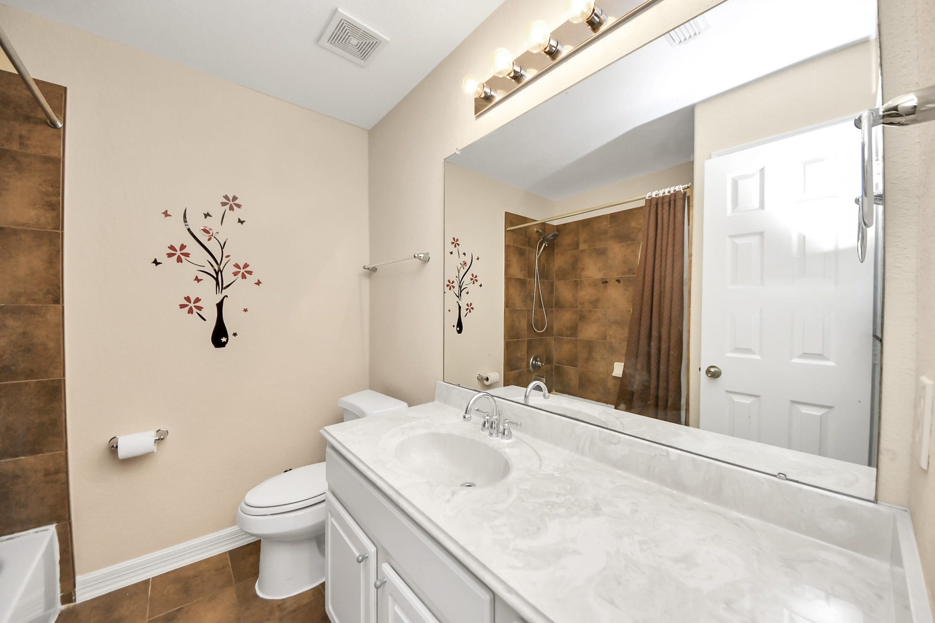 3003 Birch Landing Court, Pearland, TX 77584 This full bath features a wide vanity and a shower-tub combination, styled in a crisp, understated palette.