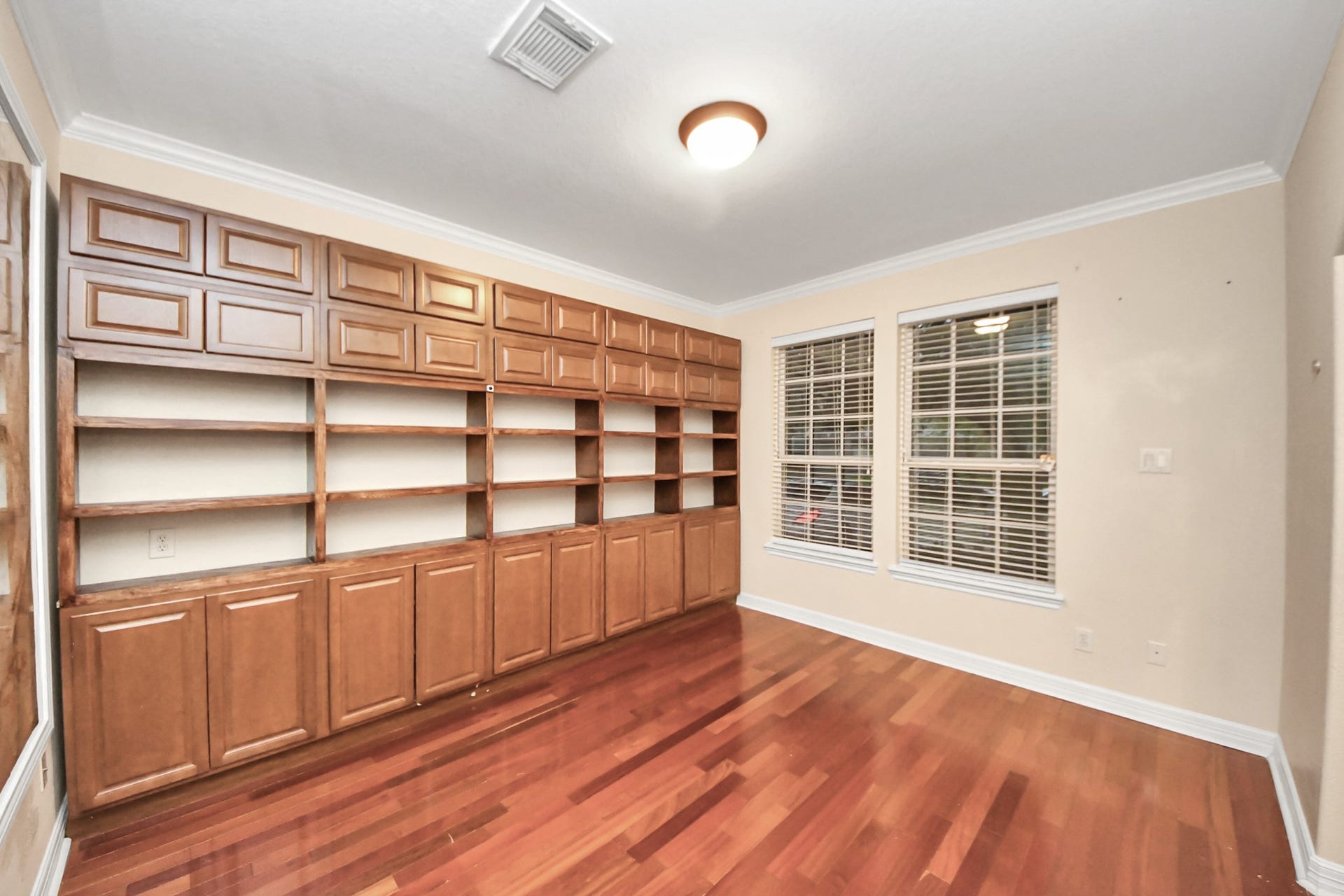 3003 Birch Landing Court, Pearland, TX 77584 The study features an impressive built-in shelf spanning an entire wall, offering refined workspace and display potential.