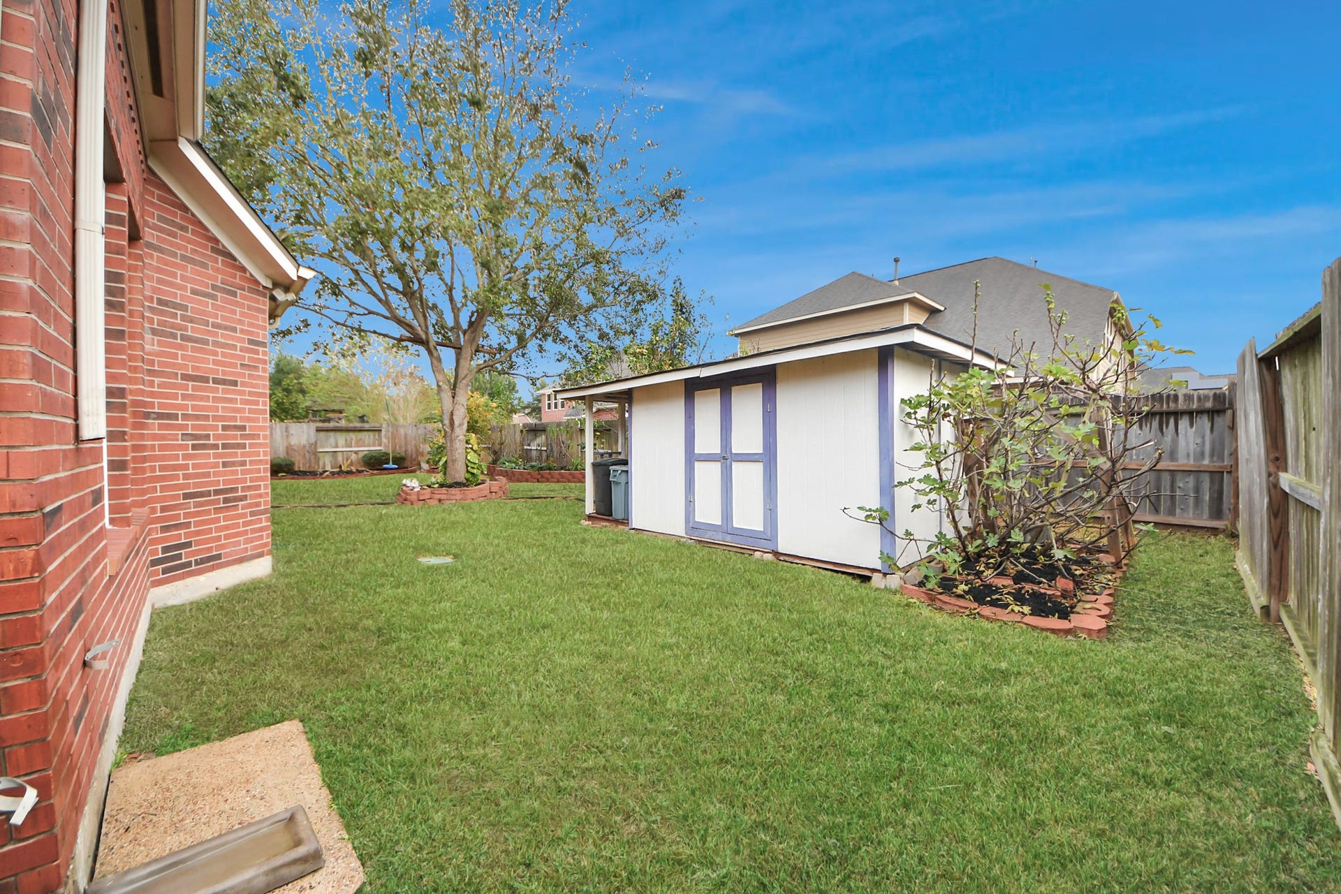 3003 Birch Landing Court, Pearland, TX 77584 A storage shed stands ready to house tools, gear, or seasonal dcor with ease.