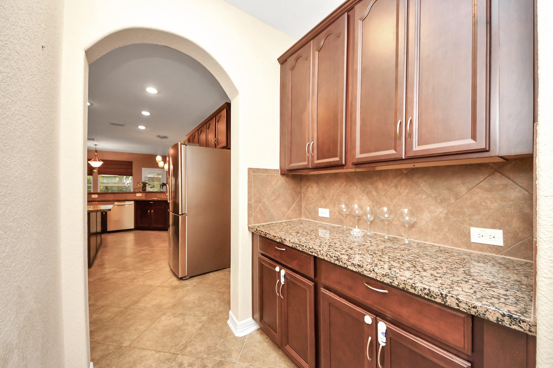 3003 Birch Landing Court, Pearland, TX 77584 The butlers pantry continues the kitchens aesthetic, delivering generous cabinetry and a broad counter for overflow prep or display.