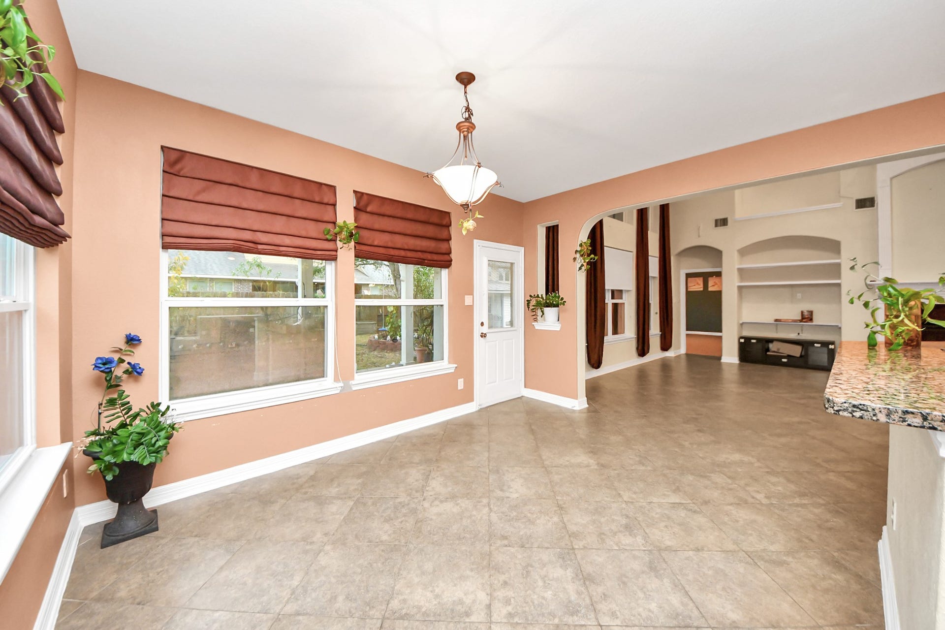 3003 Birch Landing Court, Pearland, TX 77584 The breakfast area is lined by wide windows and offers backyard views, with effortless access to the patio for indoor-outdoor flow.