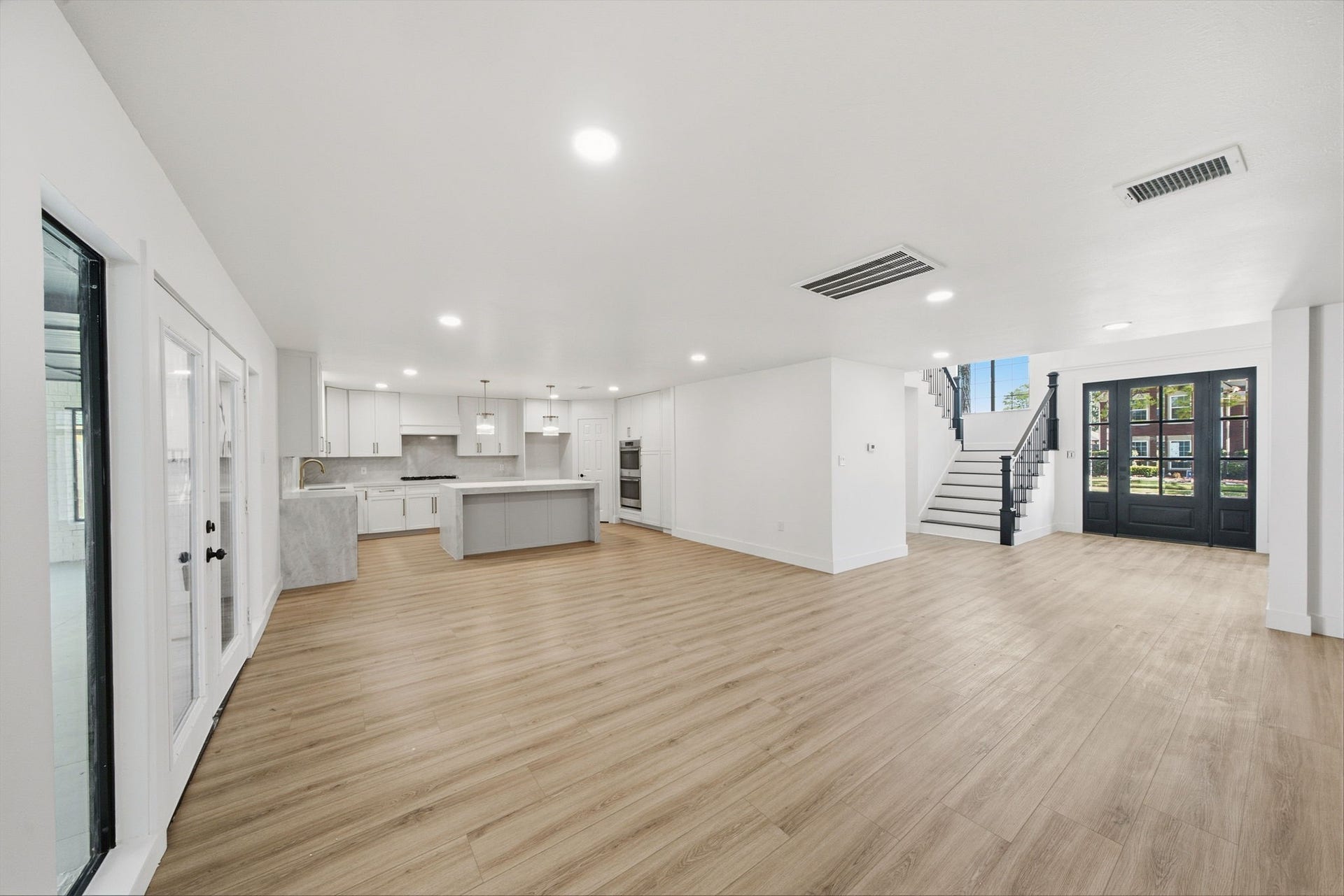 2304 Eagles Way, Pearland, TX 77581 Open concept living and kitchen spaces connect beautifully to the back patio, creating an ideal setting for everyday living and entertaining.