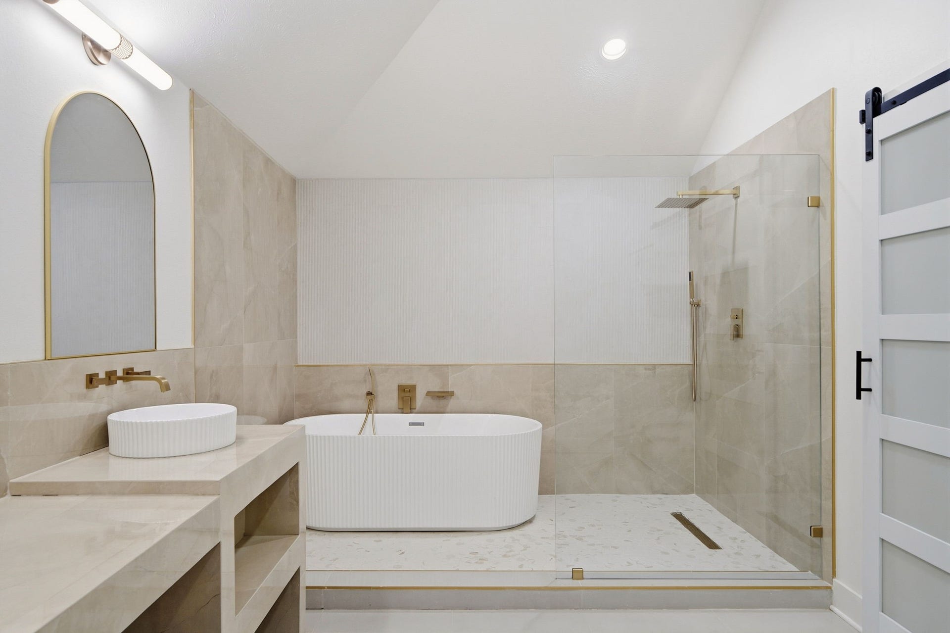 2304 Eagles Way, Pearland, TX 77581 Beautifully finished vanity, fluted soaking tub and large seamless glass shower perfect for your private retreat!