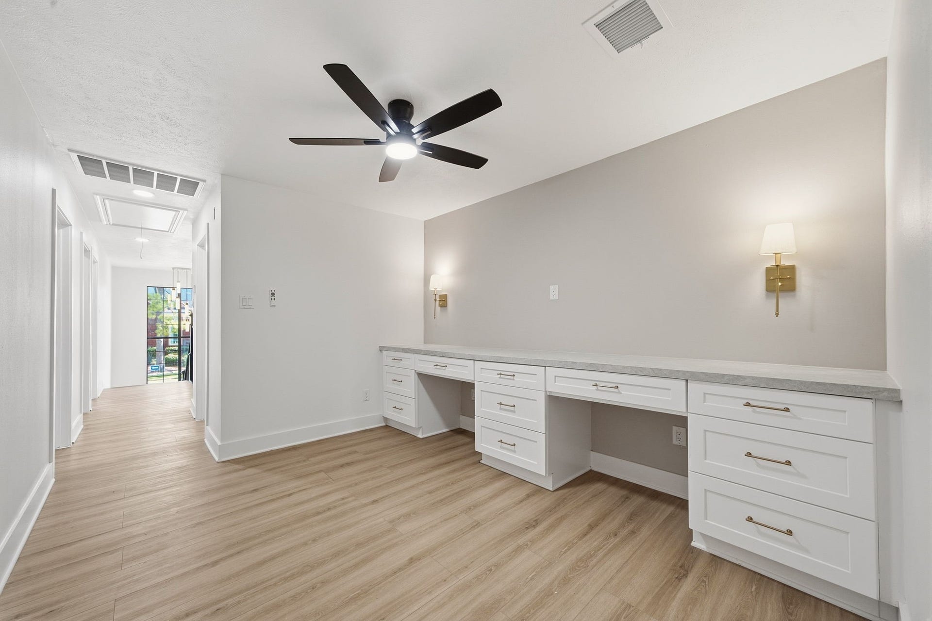 2304 Eagles Way, Pearland, TX 77581 Dedicated study featuring an expansive built-in workspace, abundant cabinetry and dual desk areas-ideal for home office, homework station or creative space.