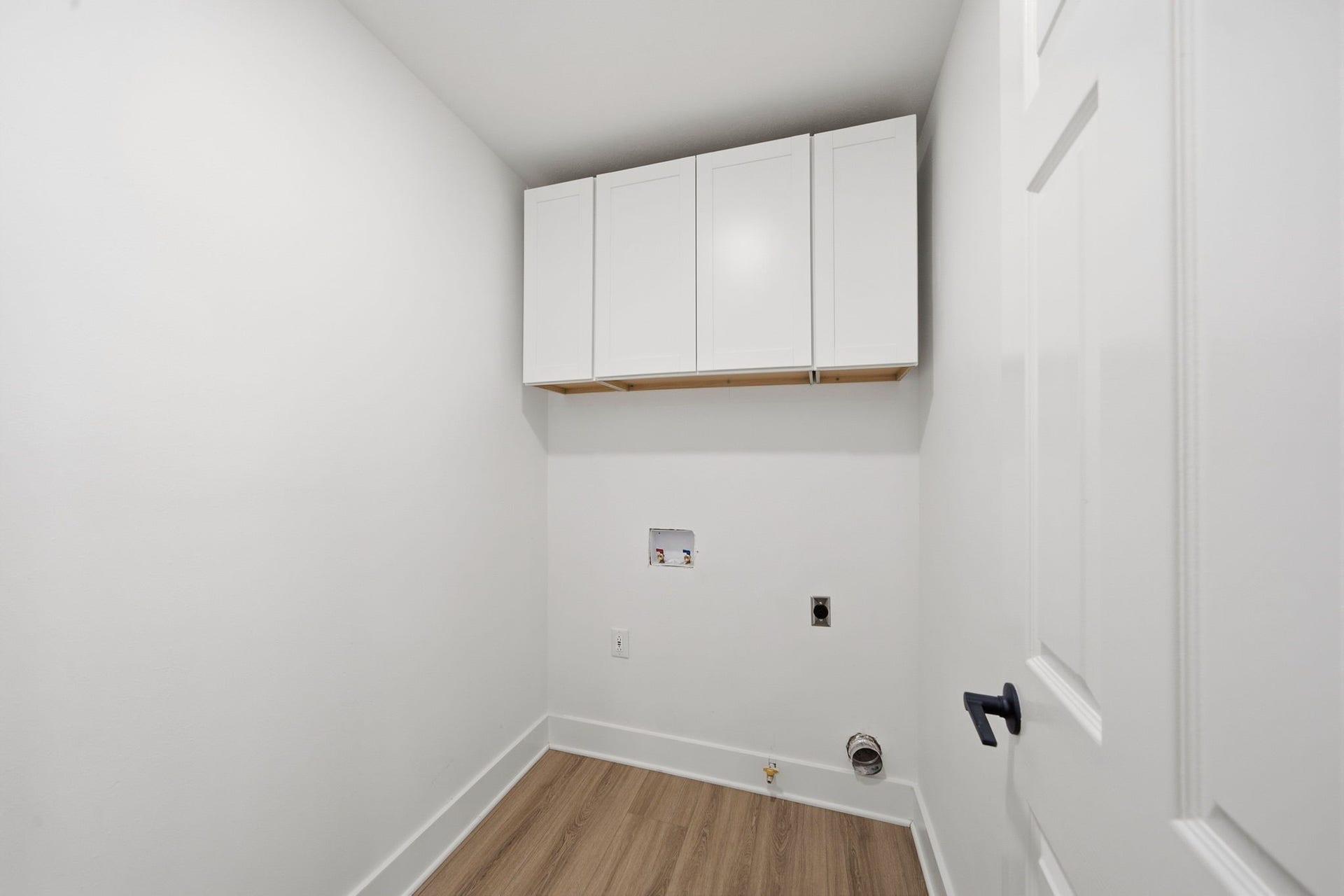 2304 Eagles Way, Pearland, TX 77581 Well placed upstairs laundry room features built-in cabinetry and practical storage for everyday convenience.