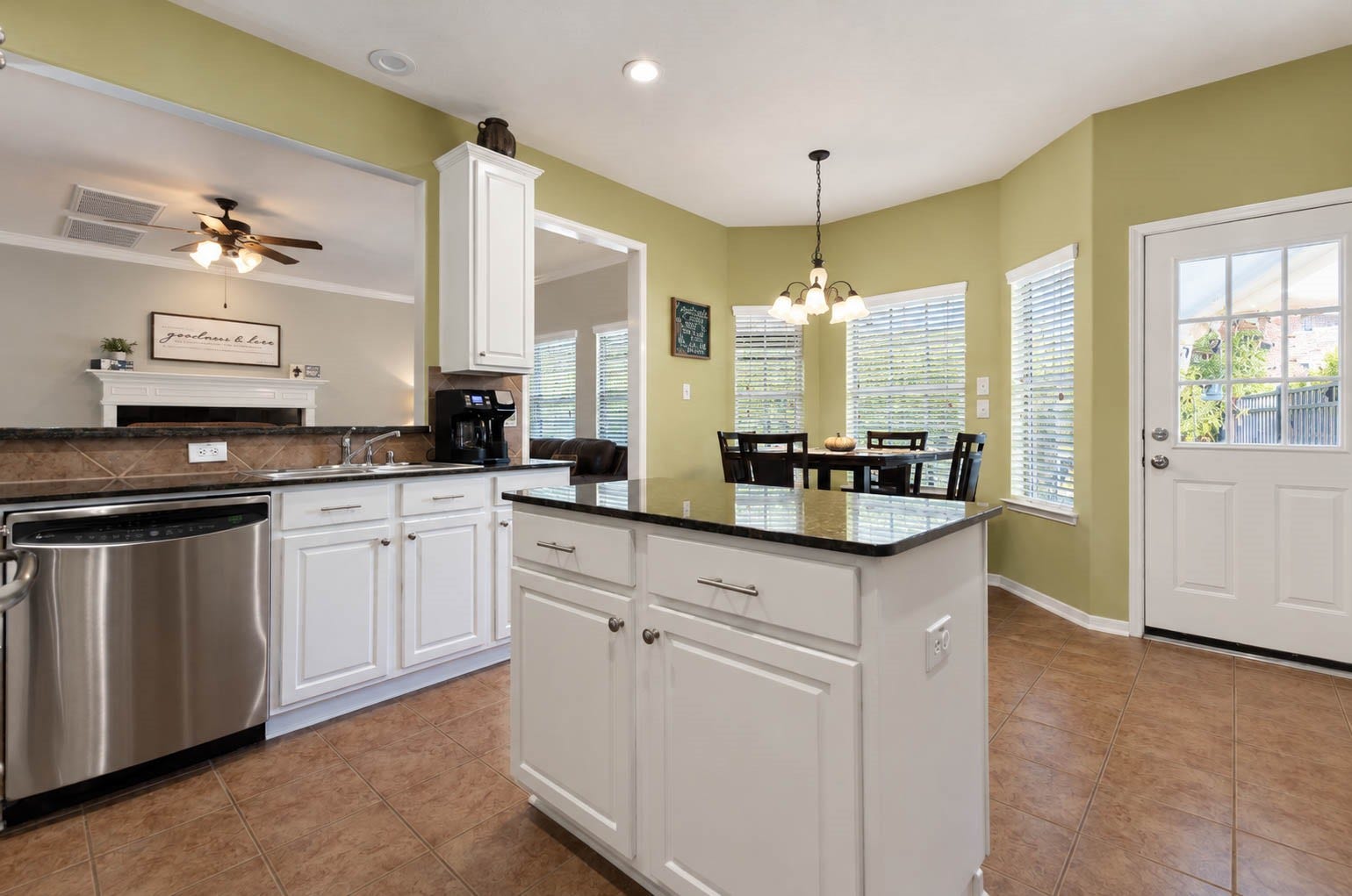 2532 Oak Dale Way, Seabrook, TX 77586 The generous island is a natural gathering spot for meal prep, with a roomy work surface, built-in outlet, and storage in the drawers and cabinets below.