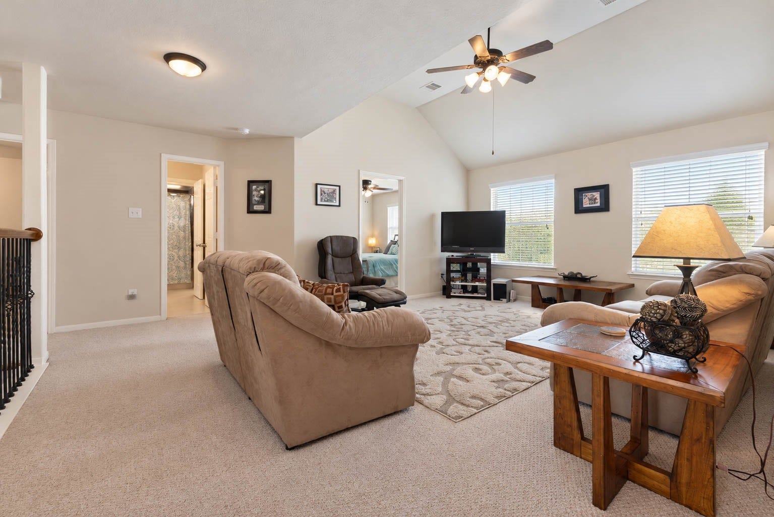 2532 Oak Dale Way, Seabrook, TX 77586 From this angle, the game room shows how well it connects to the rest of the second level, with a secondary bedroom and a bath just steps away. Wrought iron spindles line the railing and overlook the floor below, adding a touch of character to the landing.