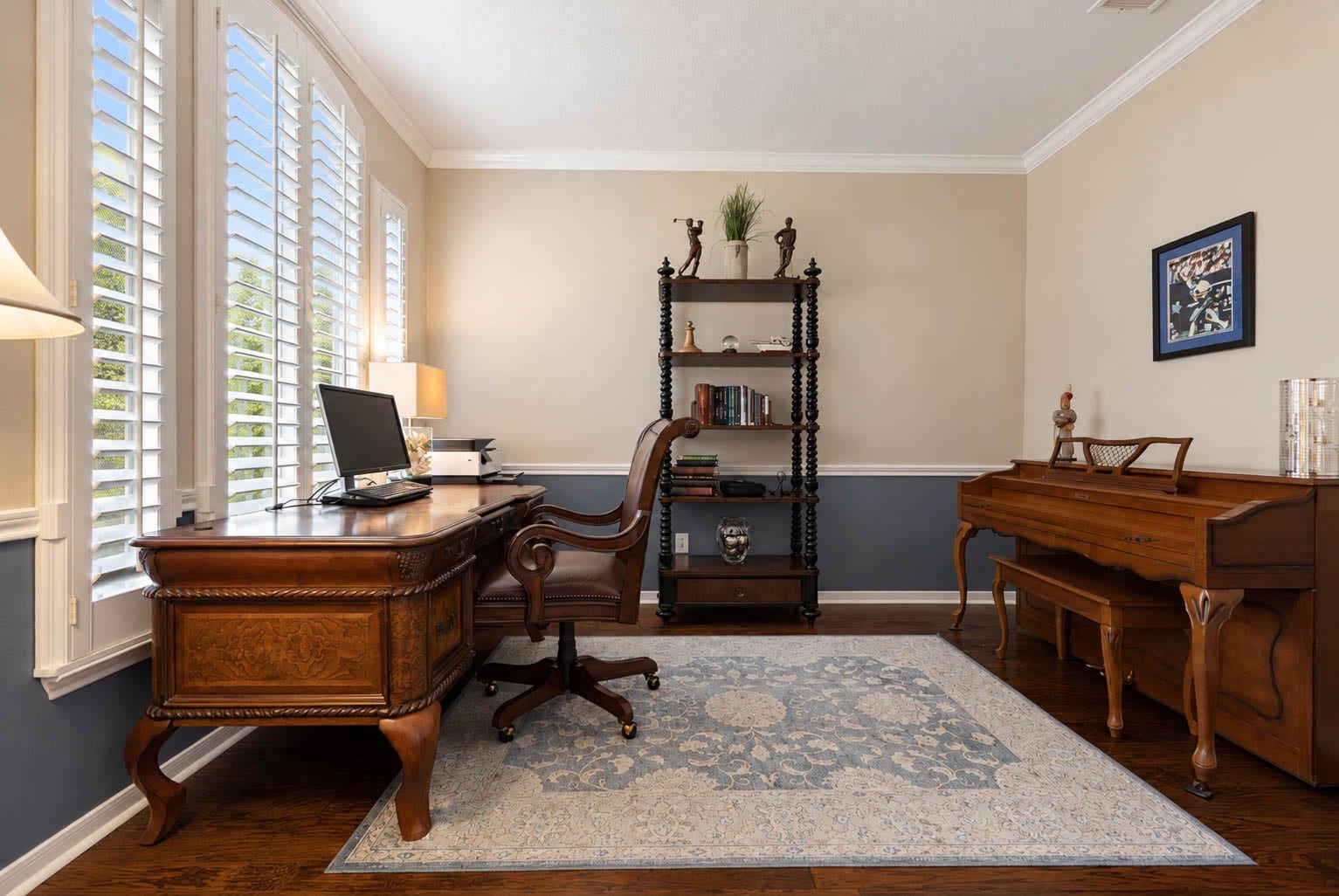 2532 Oak Dale Way, Seabrook, TX 77586 This private study sits just off the foyer with ample space for a full office setup. Two tone paint with a chair rail and crown molding add a tailored feel, while windows dressed in plantation shutters overlook the front yard and let in soft, filtered light. Hardwood floors complete the room!
