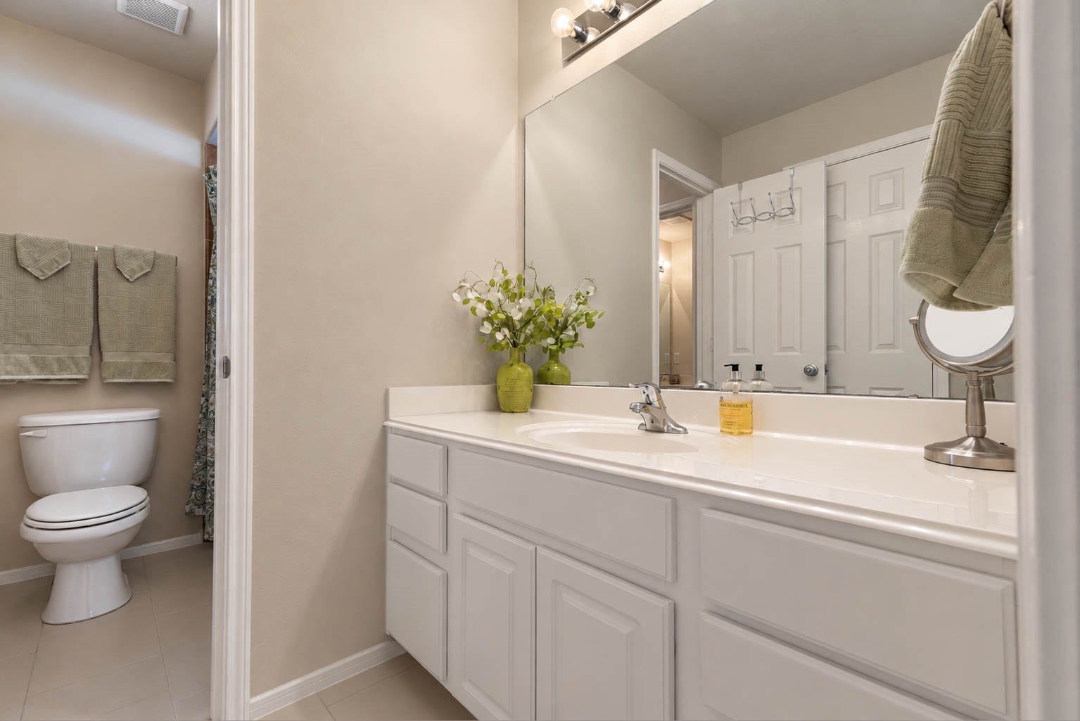 2532 Oak Dale Way, Seabrook, TX 77586 This bath features a generous vanity with abundant cabinet and drawer storage, a full width mirror, and polished fixtures with a clean, bright finish. The tub and shower combination sits just beyond, tucked away from the vanity area for added privacy.