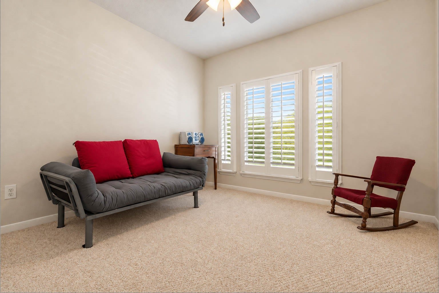 2532 Oak Dale Way, Seabrook, TX 77586 The fourth guest bedroom rounds out the homes five bedroom layout, with a trio of windows dressed in plantation shutters, a ceiling fan, and a generous carpeted floor. The open footprint adapts easily as a bedroom, study, or craft room.