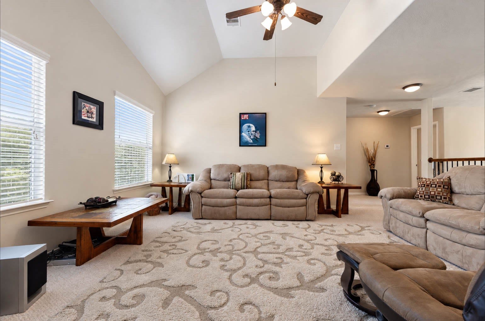 2532 Oak Dale Way, Seabrook, TX 77586 Upstairs on the second level, a game room with vaulted ceilings and plush carpet offers a versatile space for movie nights, game days, or a casual hangout. Large windows keep the room bright, and the open layout flows toward the secondary bedrooms.