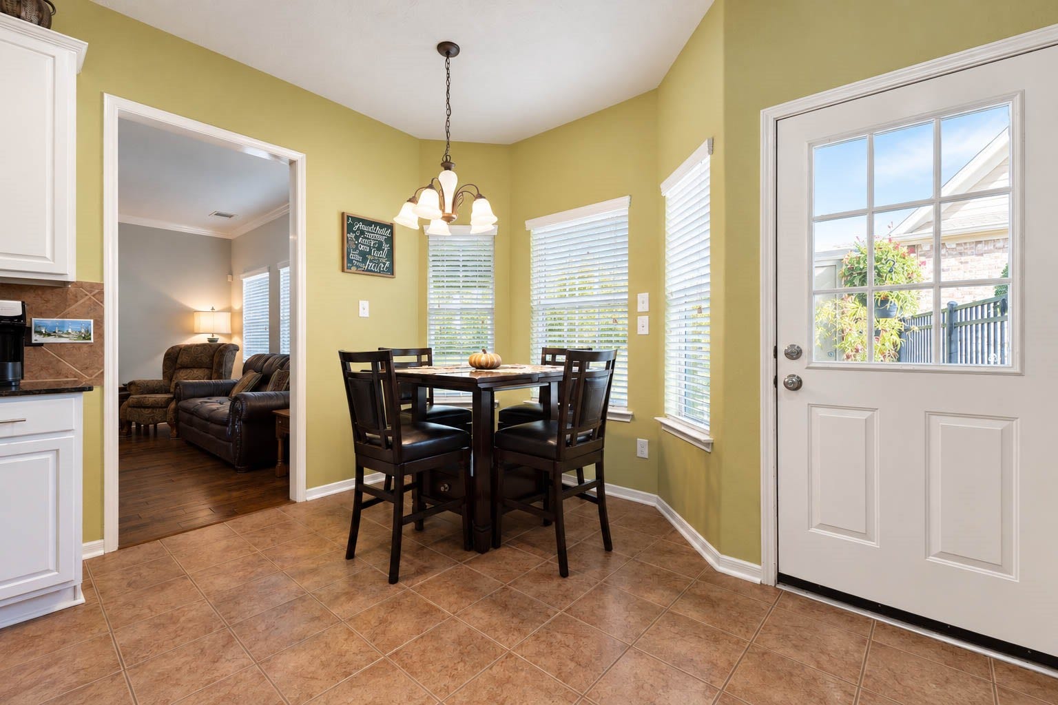 2532 Oak Dale Way, Seabrook, TX 77586 The sunny breakfast nook wrapped in windows sits just beyond the kitchen, and a door leads out to the backyard for easy outdoor entertaining.