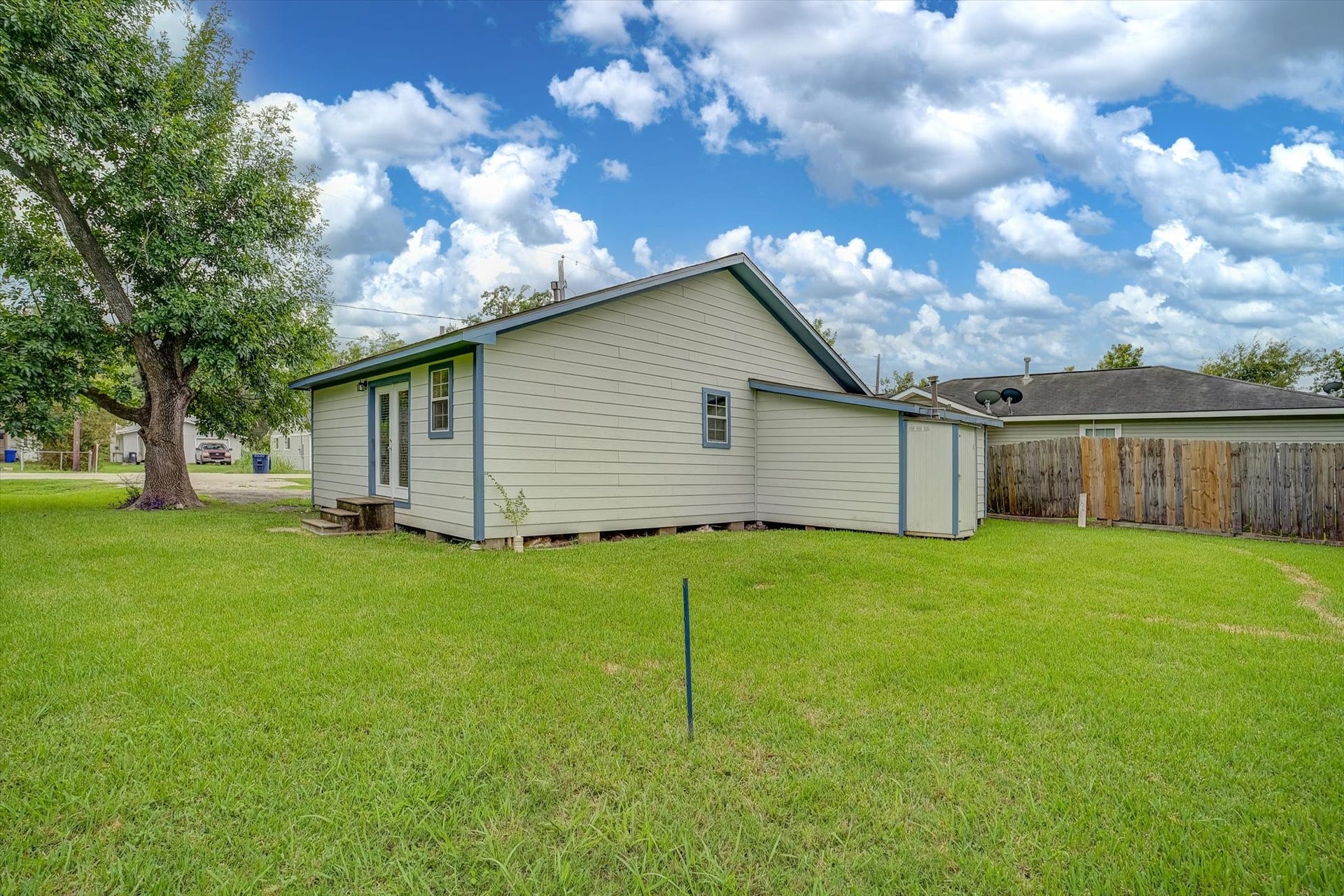 612 Harvey Street, Clute, TX 77531 Stakes mark the approximate property line.