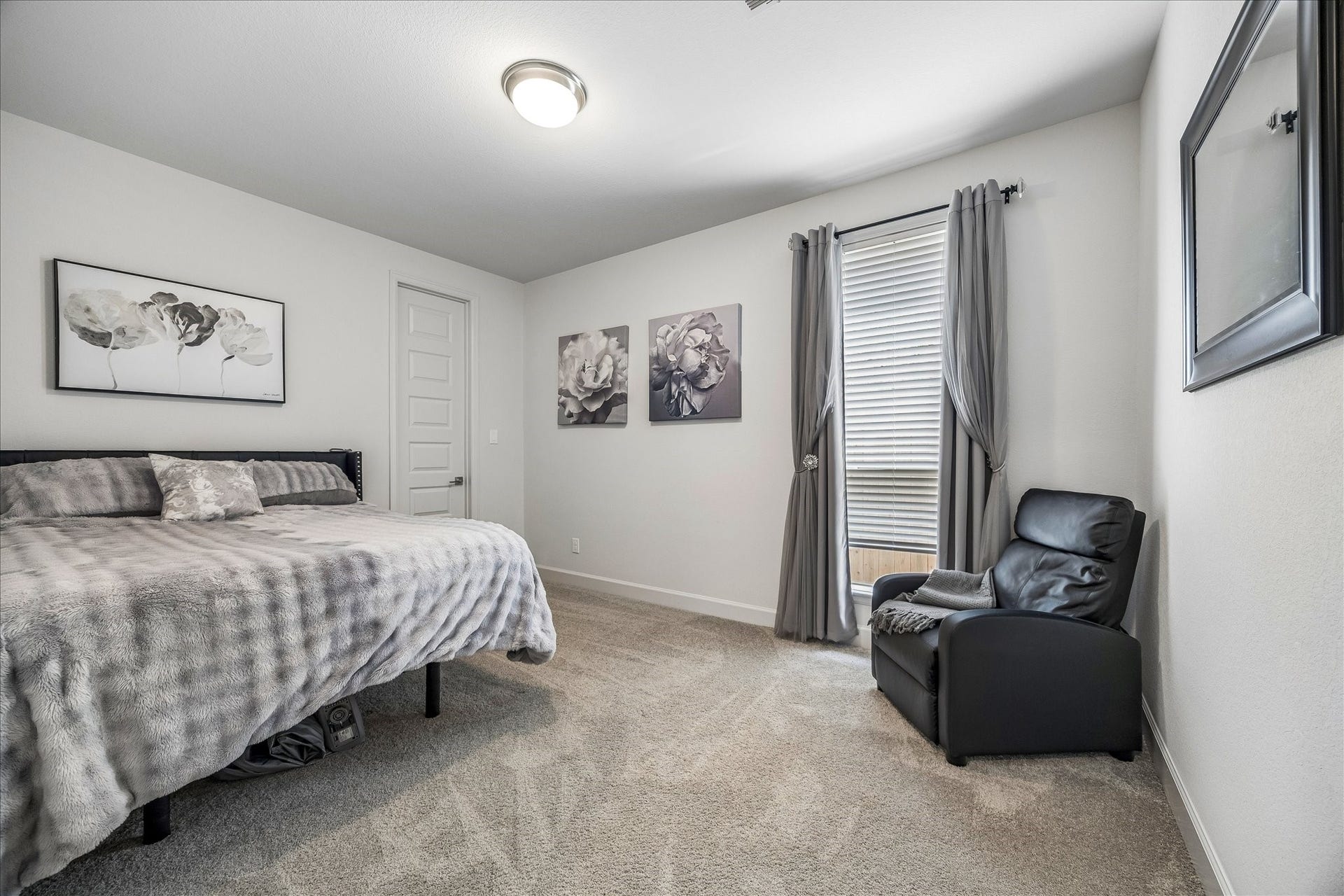 Convenient first-floor secondary bedroom with plush carpet and en-suite bath