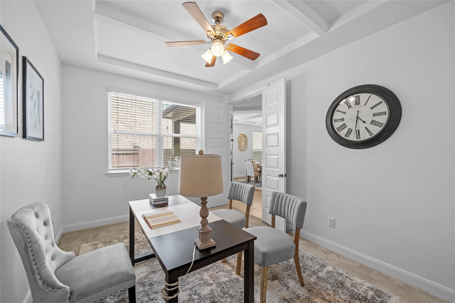 17315 Tomintoul Path, Richmond, TX 77407 Natural light fills this polished home office, where layered ceiling details and spacious dimensions create an inspiring setting for focused work or intimate meetings.