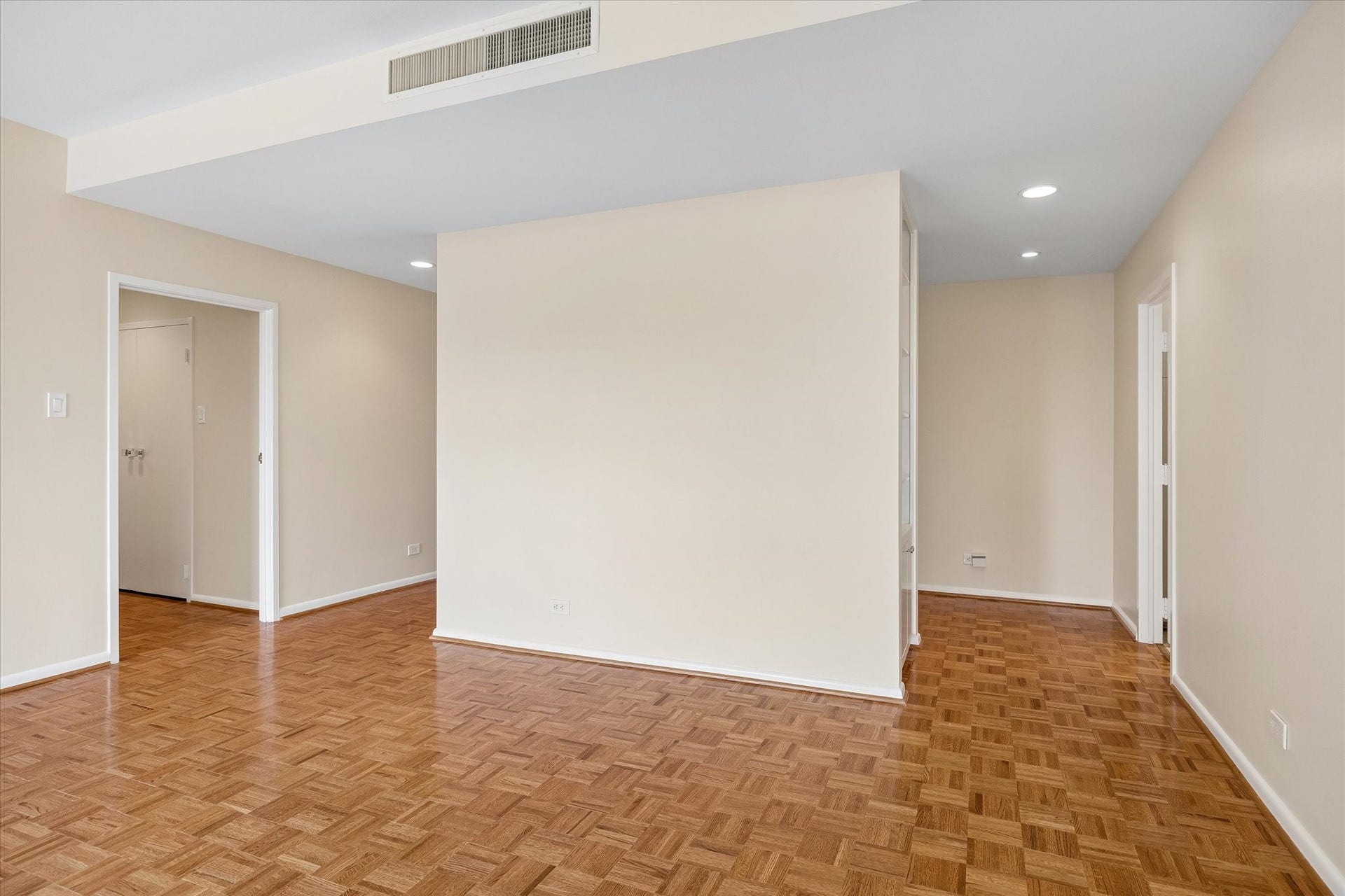 Large Living Room looking towards entry door and hallway to bedrooms