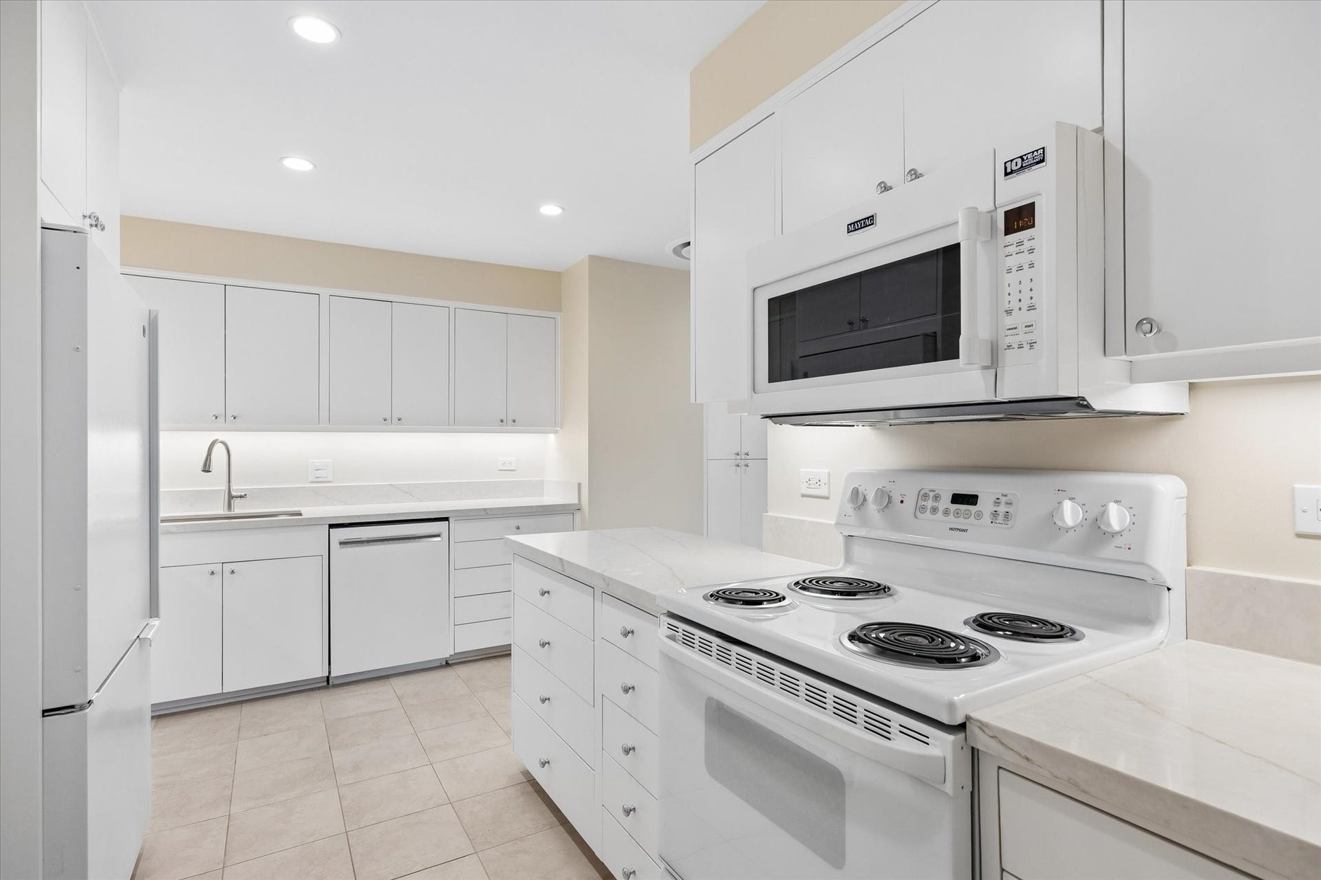 Kitchen with new granite countertops and custom cabinetry