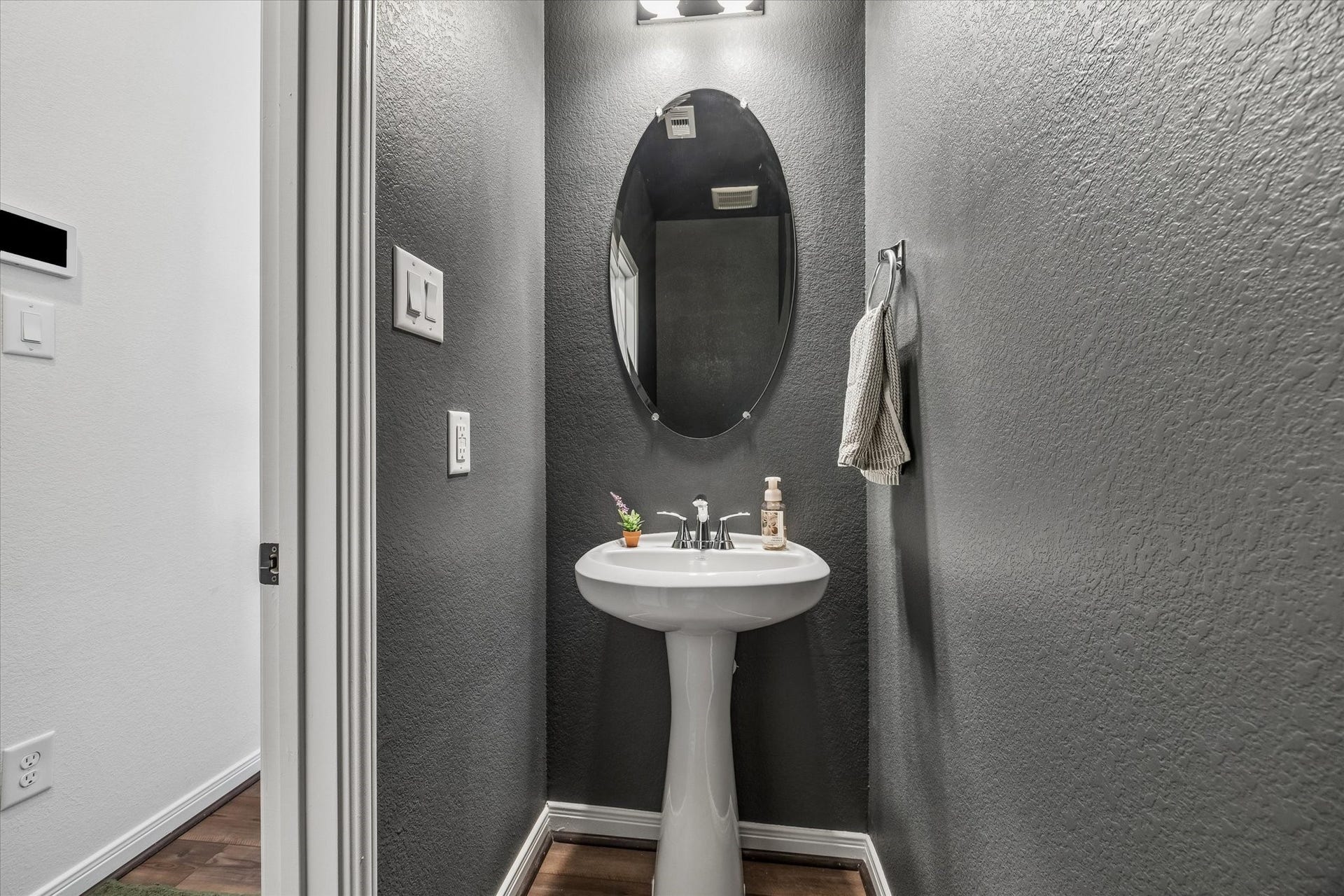 2852 Grand Anse Drive, Katy, TX 77493 Convenient first-floor half bath located just off the entry hallway with easy access from the main living areas and garage.