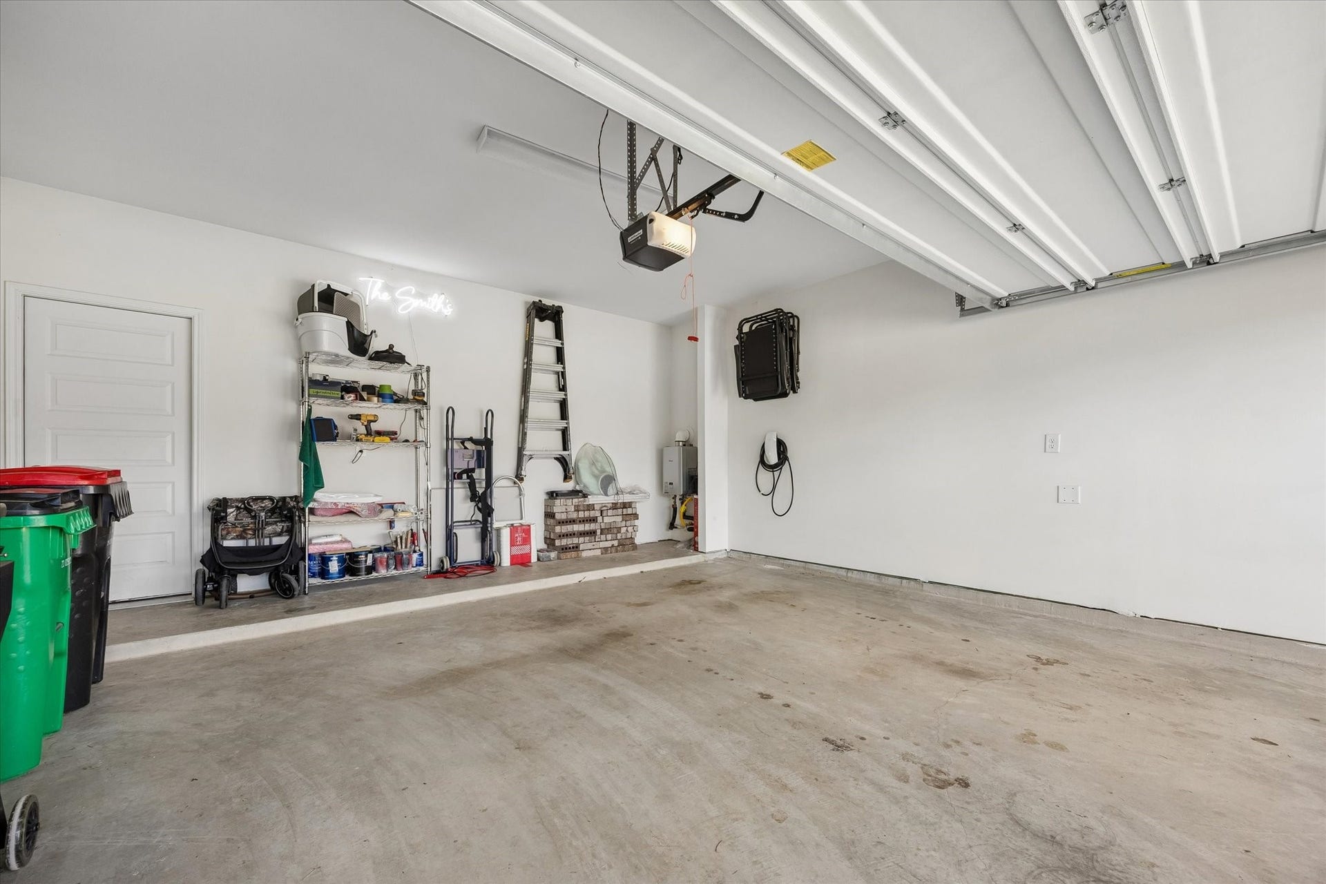 2852 Grand Anse Drive, Katy, TX 77493 Attached garage offers ample parking and storage space, plus a hardwired 48 amp EV charging connection.