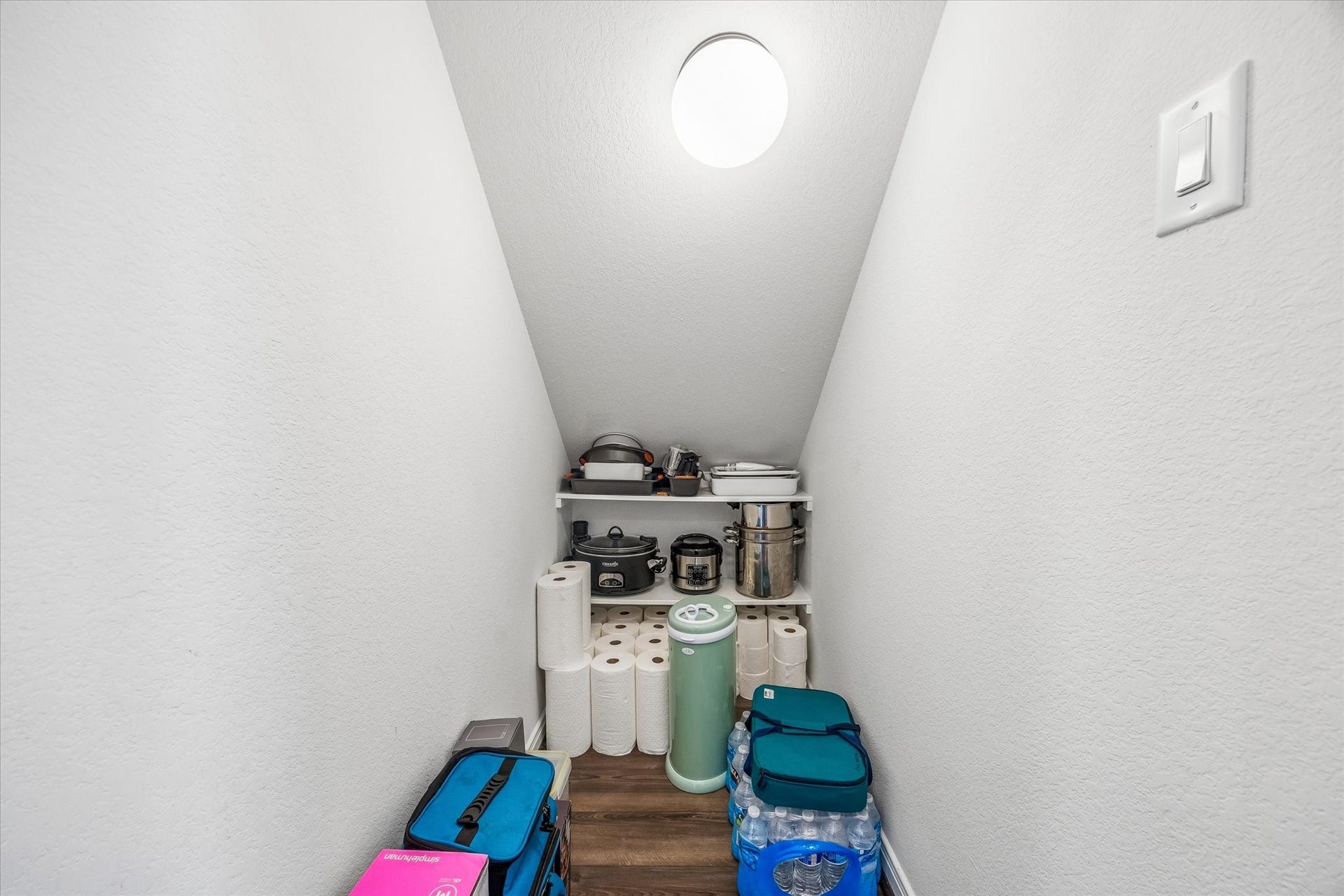 2852 Grand Anse Drive, Katy, TX 77493 Convenient under-stair storage provides additional space for pantry items and everyday household essentials.