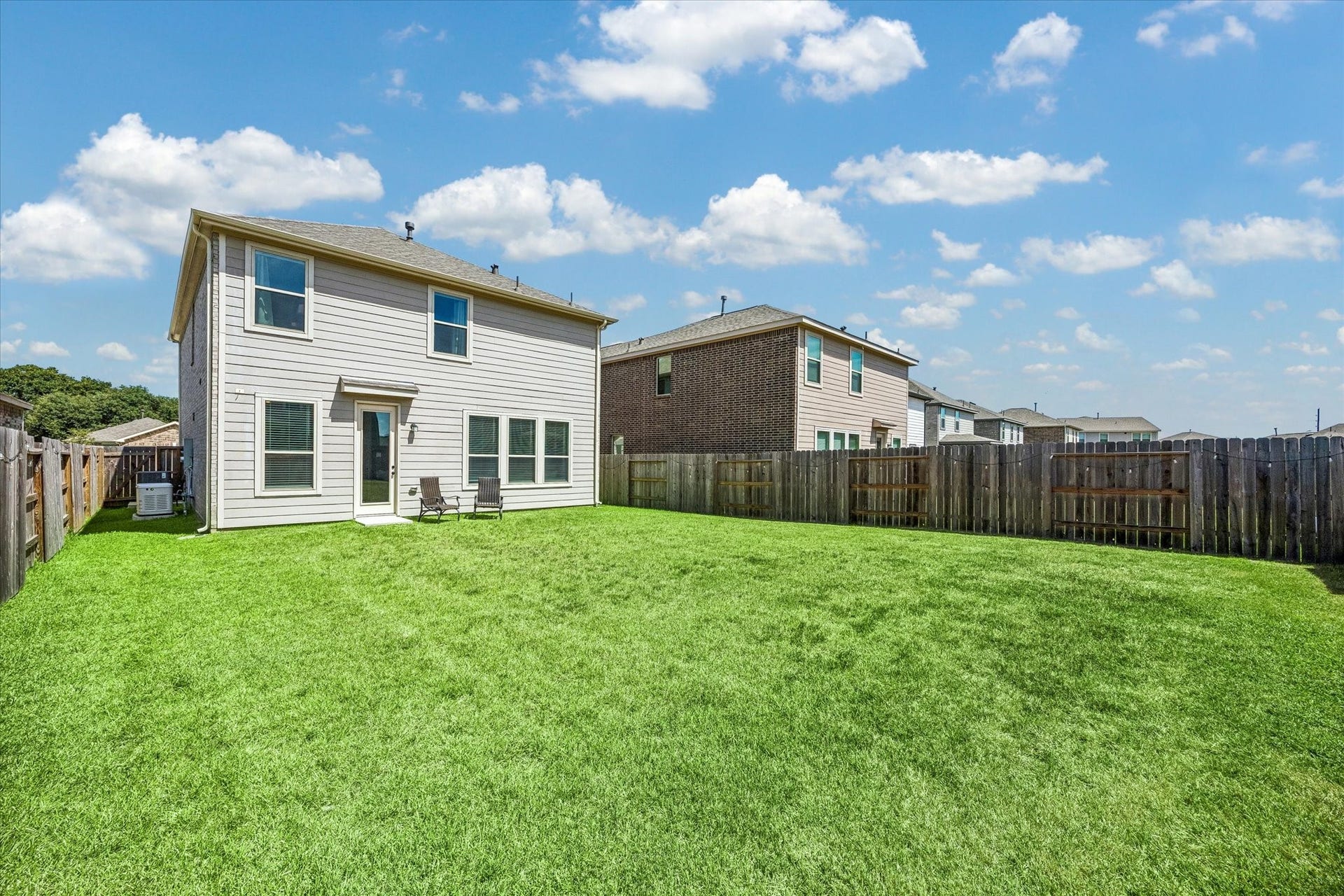 2852 Grand Anse Drive, Katy, TX 77493 Another view of the spacious fully fenced yard. Showcasing potential outdoor entertaining, pets, and play!