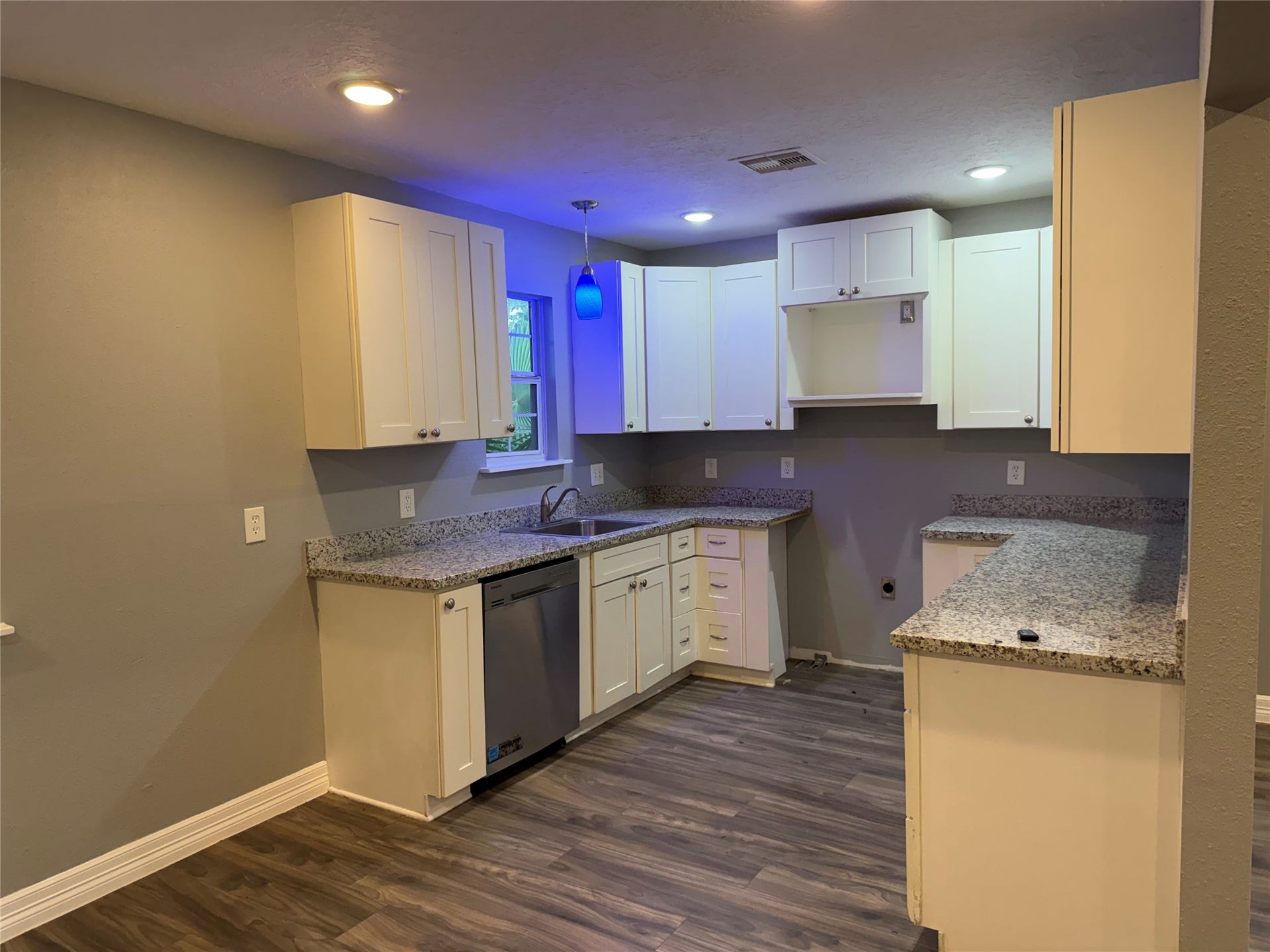 4308 6th Street, Bacliff, TX 77518 Kitchen w/ granite counters and shaker cabinets