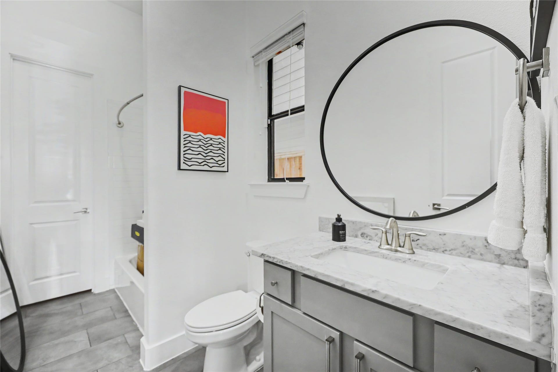 First-floor bathroom with a walk-in closet.