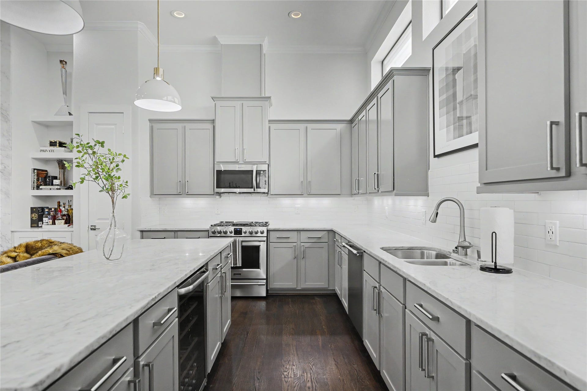 Wine fridge included along with the stainless steel refrigerator in this gourmet kitchen.