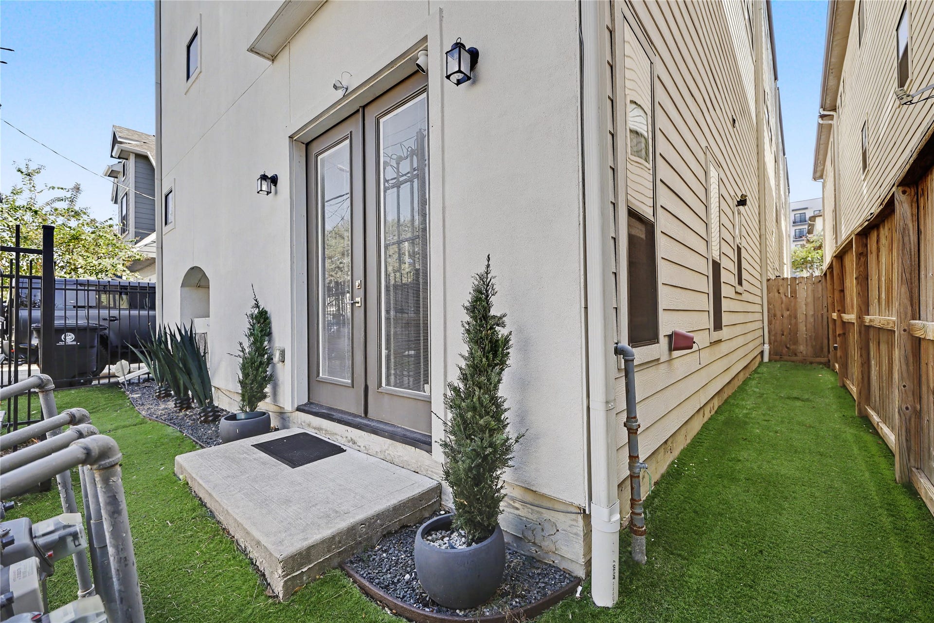 View of the side yard and backyard. A true lock and leave lifestyle.