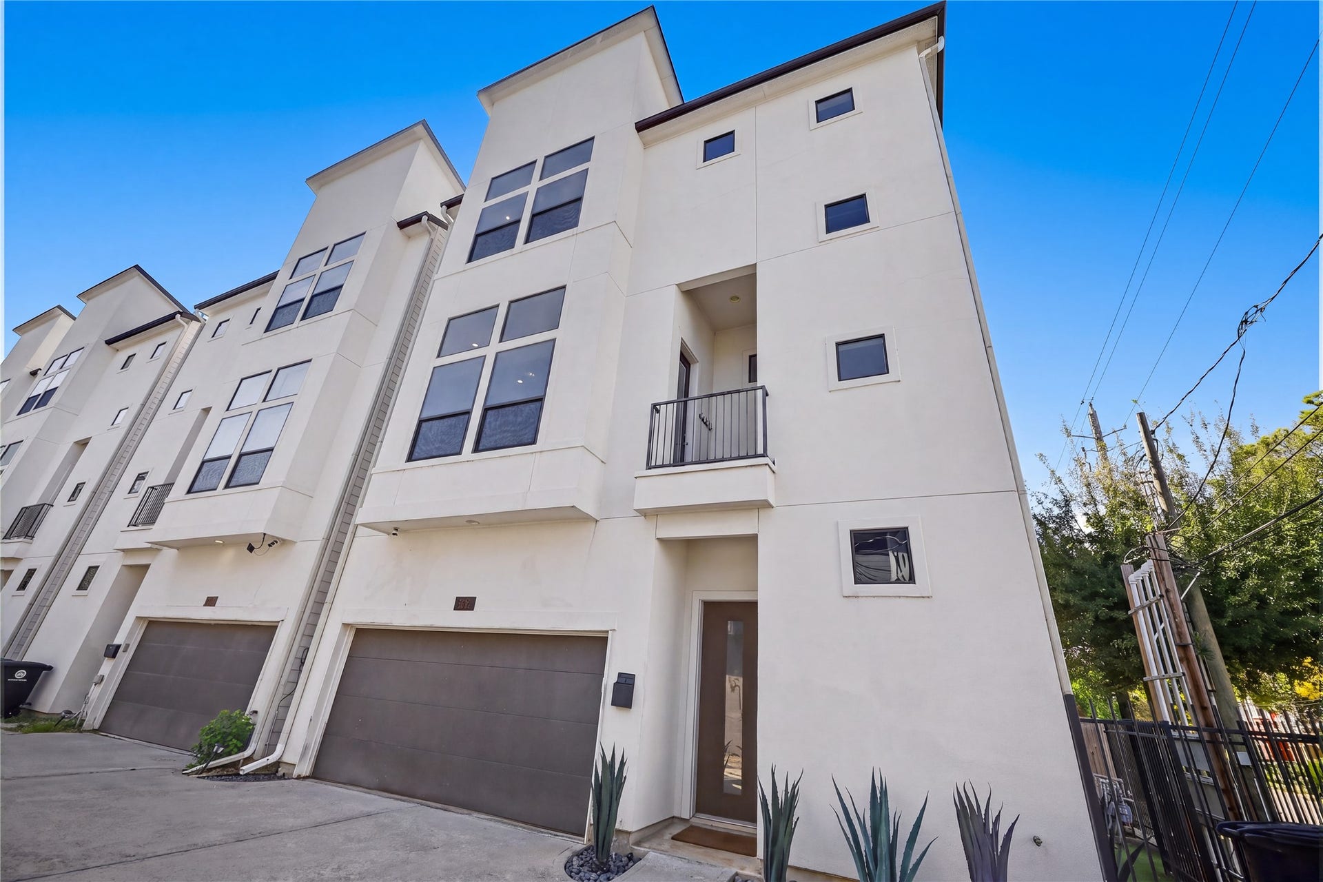 Corner unit with fenced-in turfed grass for pets. Two car garage and easy street parking.