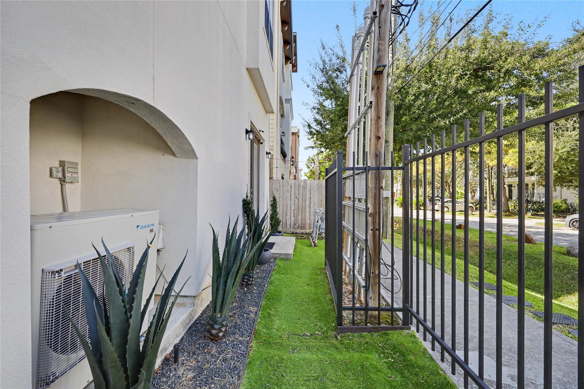 A look at the fenced in yard with turf for zero maintenance.