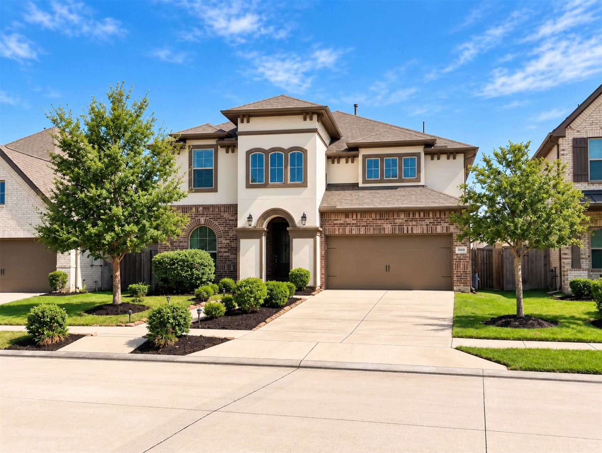 8822 SPINNING MILL DRIVE, Missouri City, TX 77459 THIS TWO-STORY SIENNA HOME FEATURES A MIXED BRICK AND STUCCO EXTERIOR, LANDSCAPED FRONT YARD, AND ATTACHED TWO-CAR GARAGE.