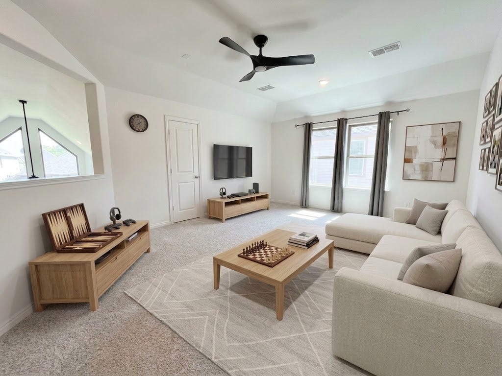 8822 SPINNING MILL DRIVE, Missouri City, TX 77459 THE UPSTAIRS GAME ROOM PROVIDES A SPACIOUS SECOND LIVING AREA WITH A CEILING FAN AND CARPET.