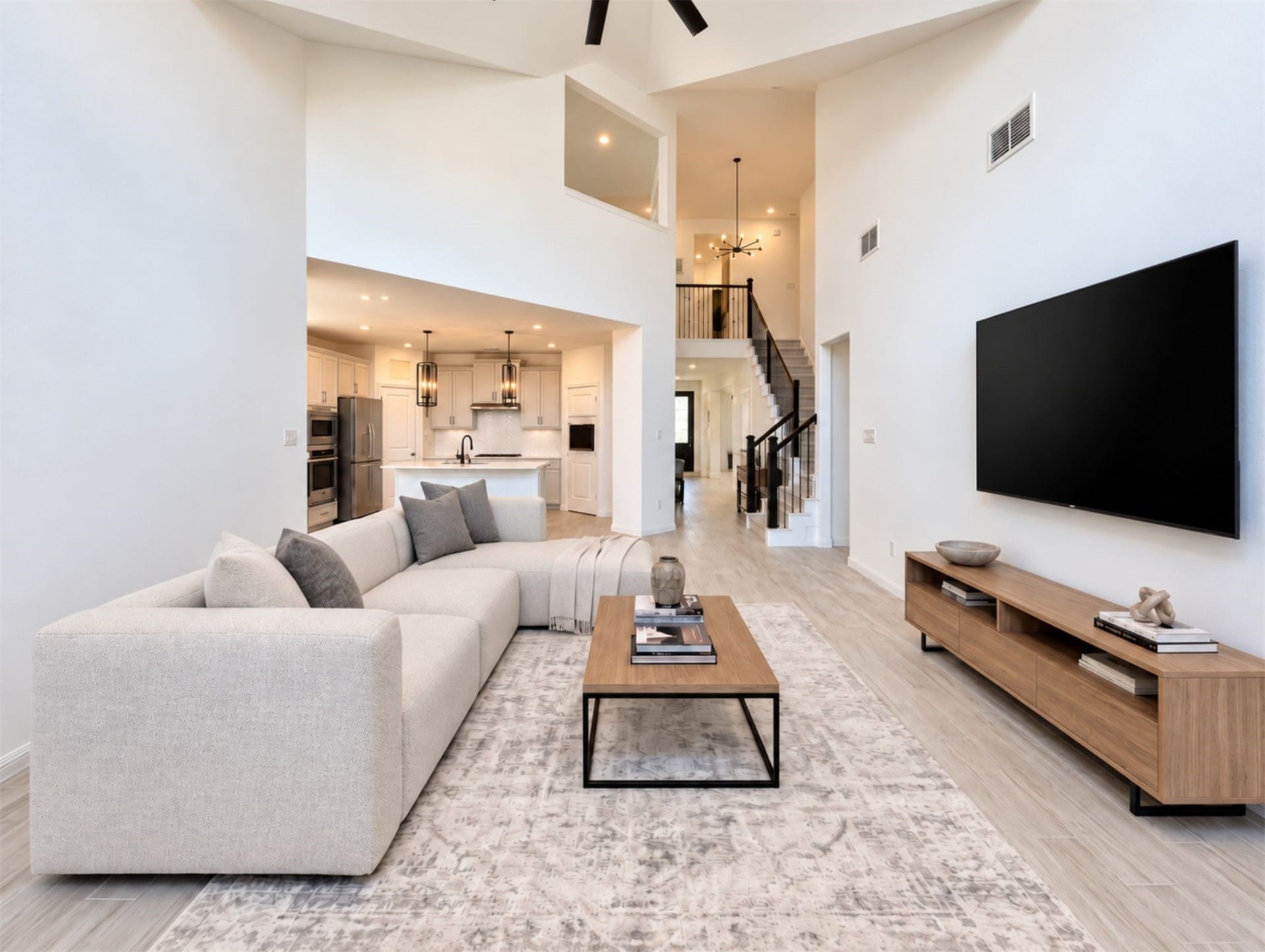 8822 SPINNING MILL DRIVE, Missouri City, TX 77459 THE FAMILY ROOM OPENS TO THE KITCHEN, WITH A WIDE LAYOUT THAT OFFERS PLENTY OF SPACE TO GATHER.