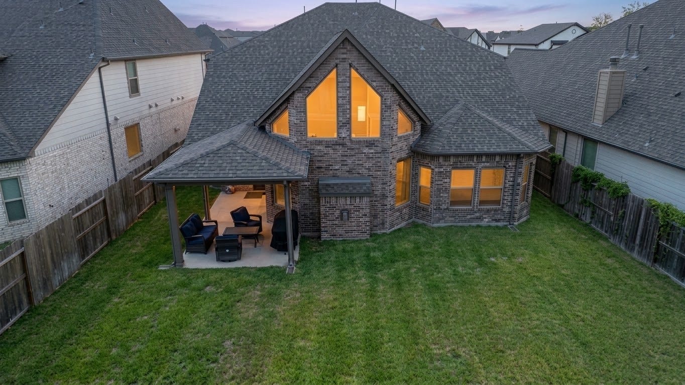 8822 SPINNING MILL DRIVE, Missouri City, TX 77459 THE AERIAL VIEW SHOWS THE HOMES COVERED PATIO AND LARGE, FENCED BACKYARD.