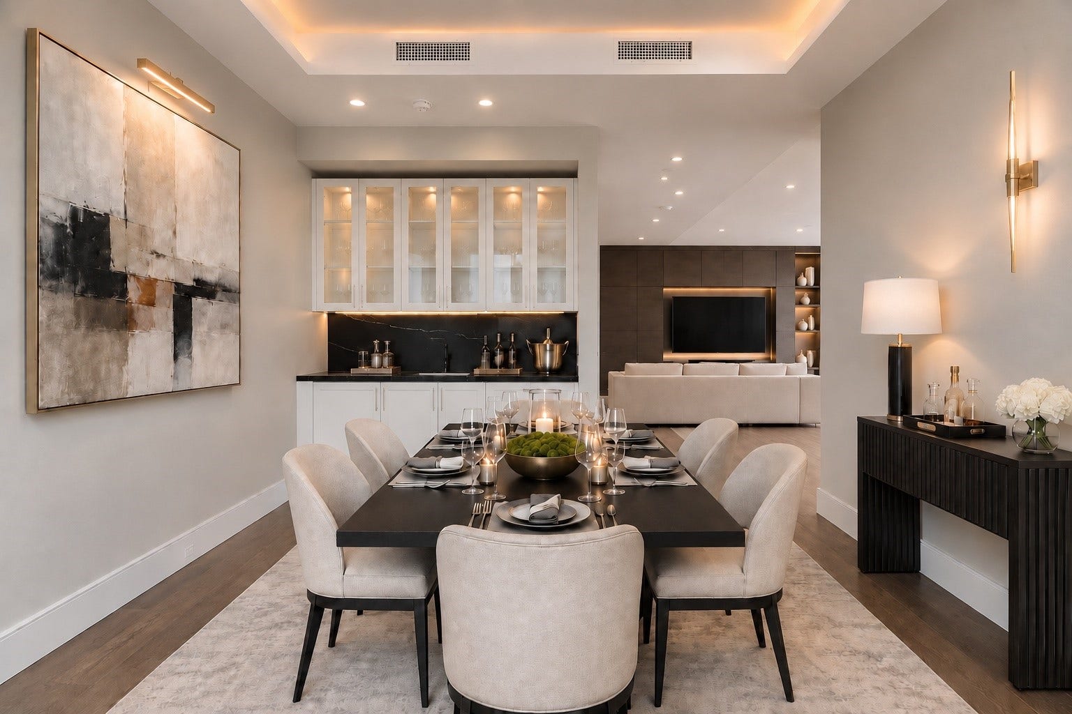 5656 San Felipe Street, Unit 701, Houston, TX 77056 An elegant formal dining room designed for effortless entertaining enhanced by an integrated built-in serving station/bar with its own ice machine. Glass cabinetry adds a refined touch while keeping stemware and entertaining essentials close to hand. The setting flows seamlessly into the adjoining living space creating an inviting atmosphere. This photo is digitally staged to show endless options for furnishing and decorating
