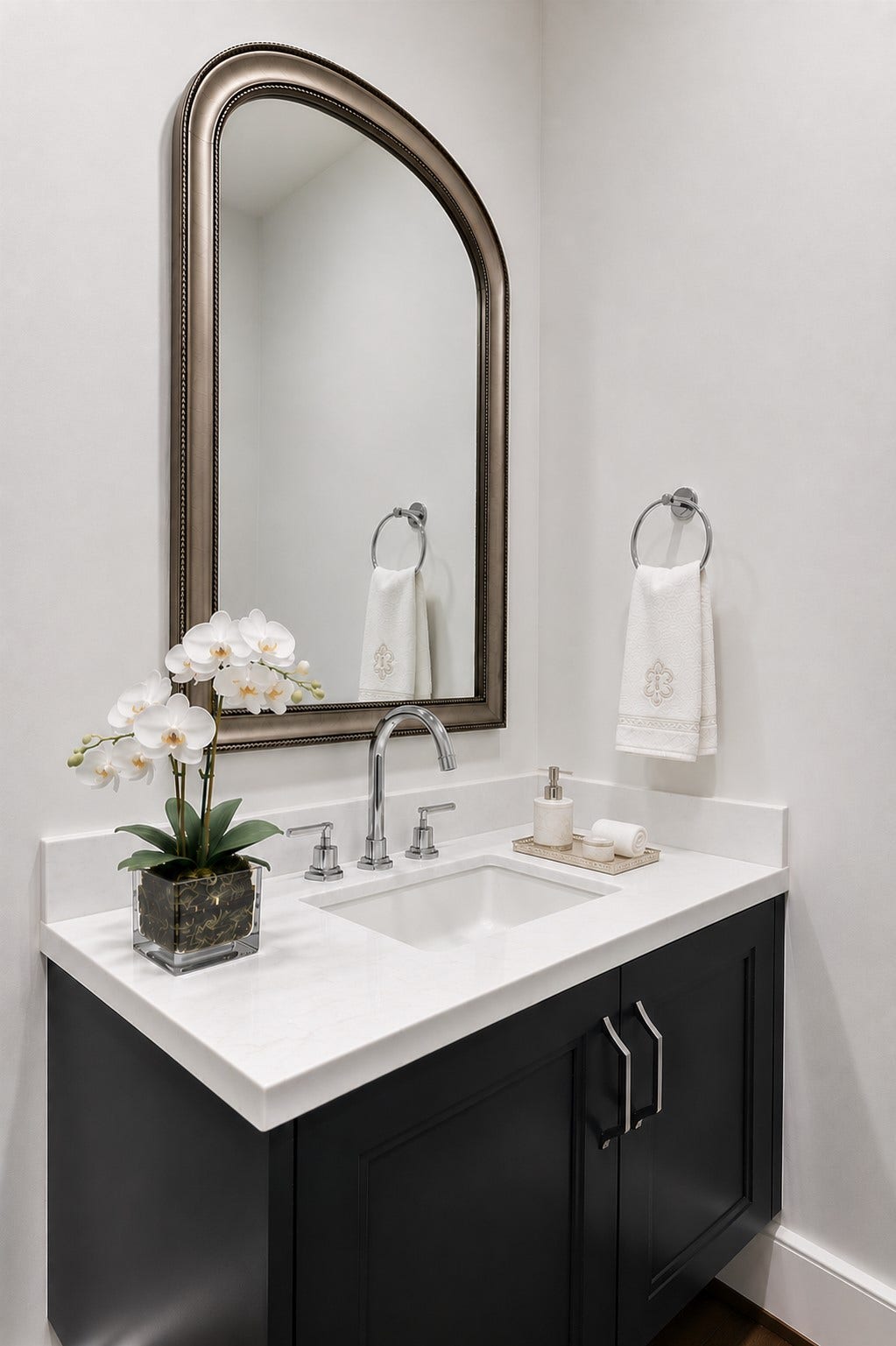 5656 San Felipe Street, Unit 701, Houston, TX 77056 Hallway powder room accented with an elegant framed mirror
