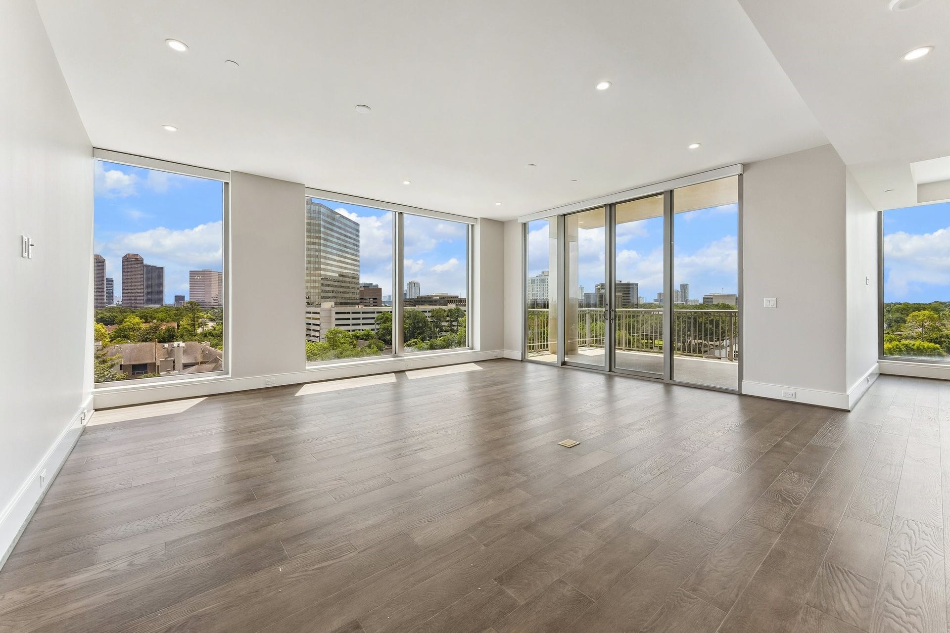 5656 San Felipe Street, Unit 701, Houston, TX 77056 Photo of actual living room to convey the spacious layout and the open concept of the living area