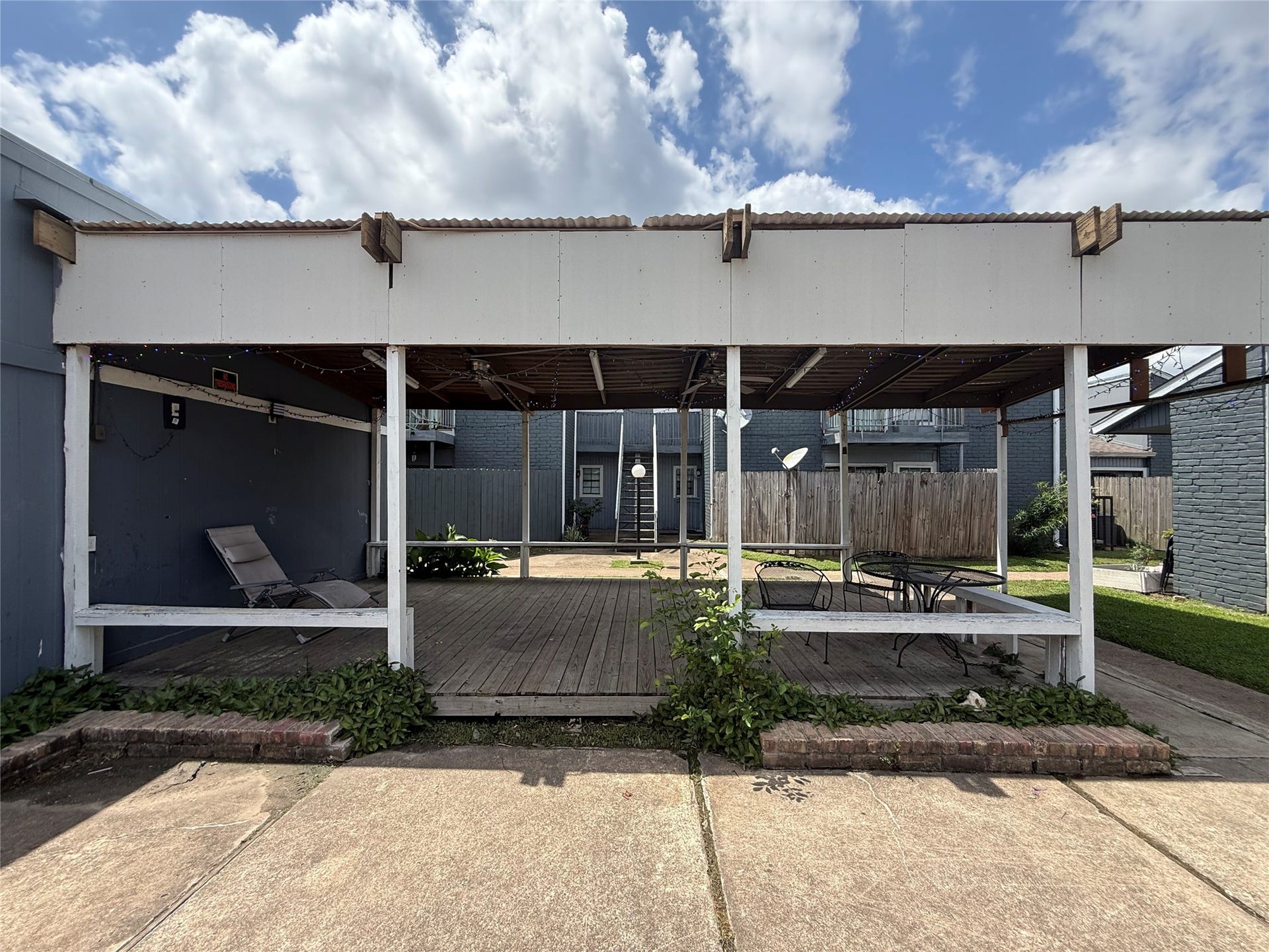 9550 Deering Drive, #210, Houston, TX 77036 The courtyard even has a covered area for entertaining or relaxing outside with the neighbors.