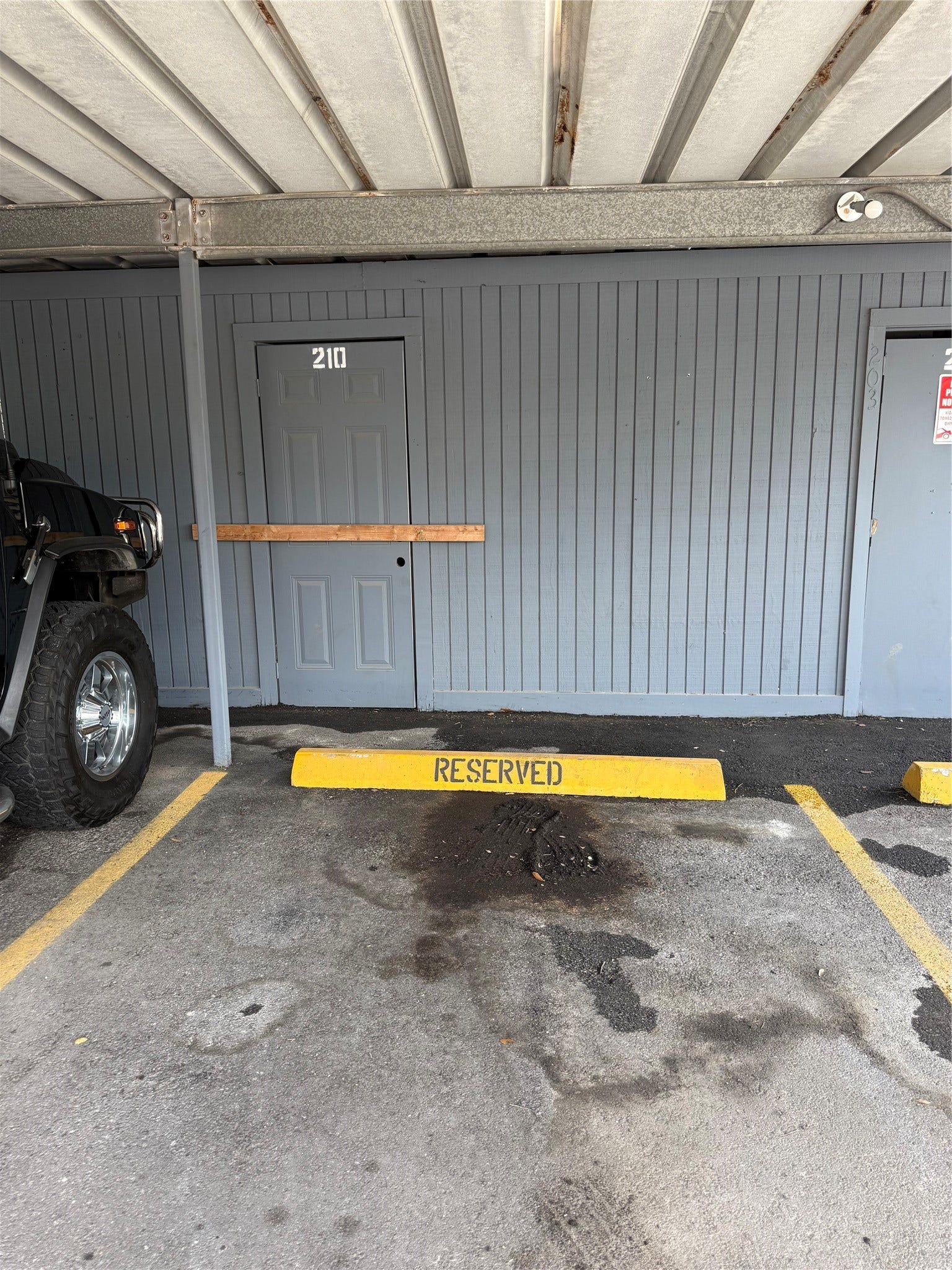 9550 Deering Drive, #210, Houston, TX 77036 Assigned covered parking space and storage closet.