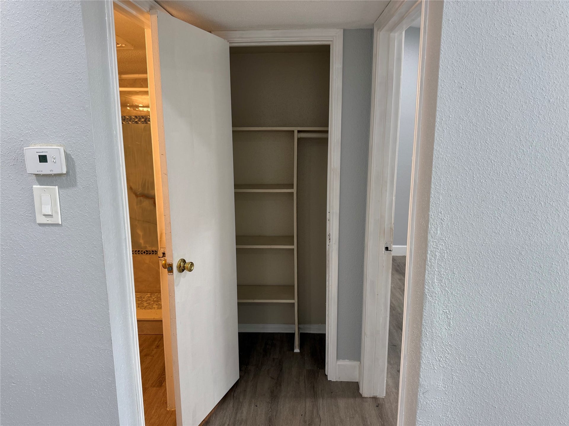 9550 Deering Drive, #210, Houston, TX 77036 Linen closet located between the bedroom and bathroom.