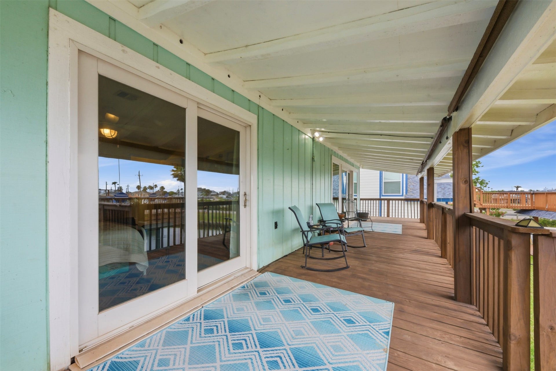 2 S Sandpiper Street, La Marque, TX 77568 Enjoy morning coffee or a night cap protected from a rain storm under your covered catwalk!