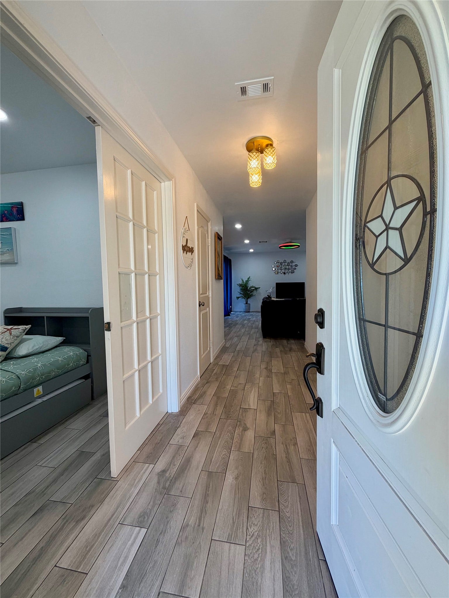 5420 Avenue O, Galveston, TX 77551 Come on in! Spacious entry, bedroom/office space to the left with double French doors, and coat/storage closet.