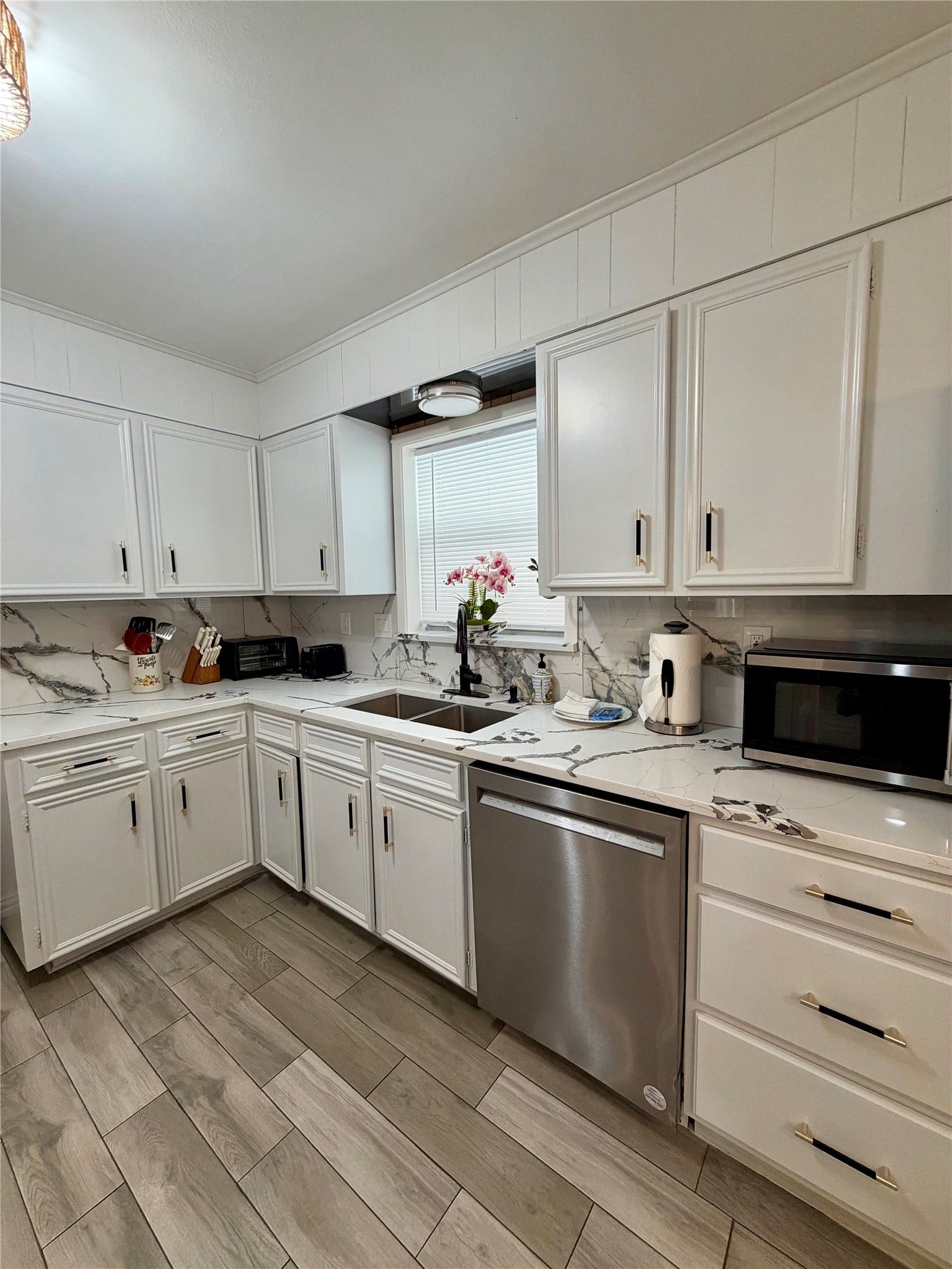 5420 Avenue O, Galveston, TX 77551 Stainless appliances and lovely kitchen window above the sink.