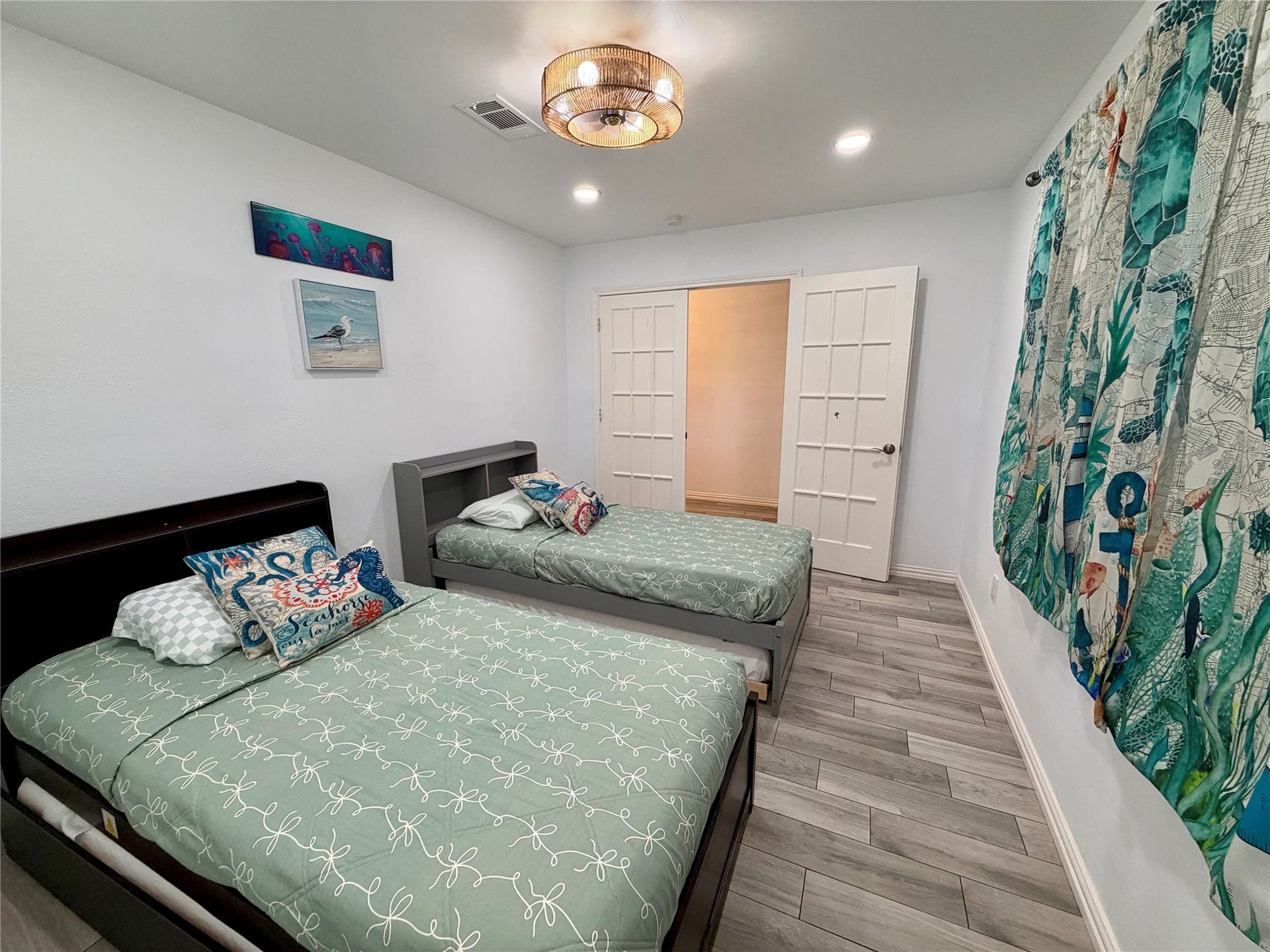 5420 Avenue O, Galveston, TX 77551 Guest bedroom 4 with double French doors and custom ceiling fan