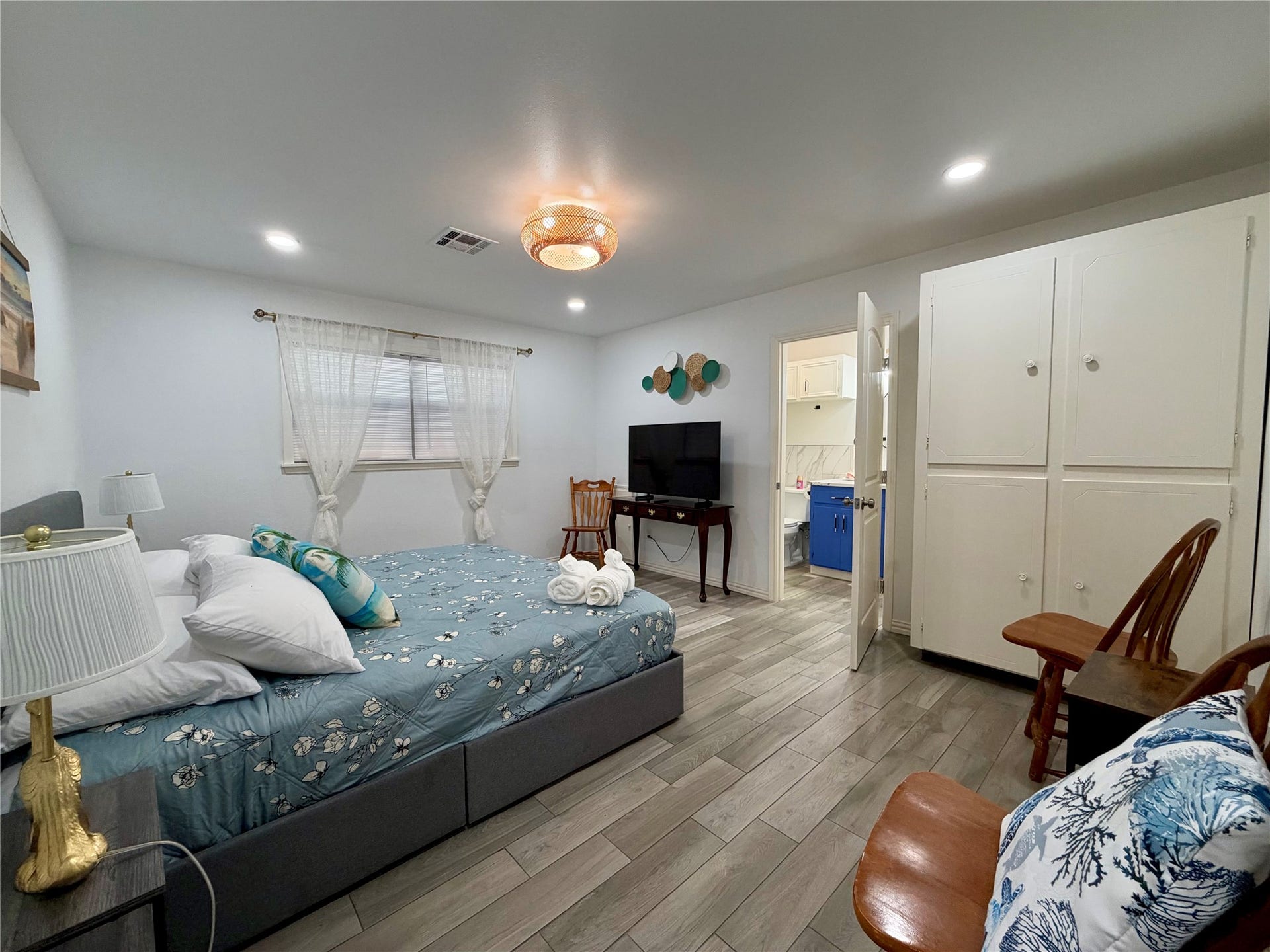 5420 Avenue O, Galveston, TX 77551 Primary bedroom with built-in storage. Ensuite bathroom to the right.