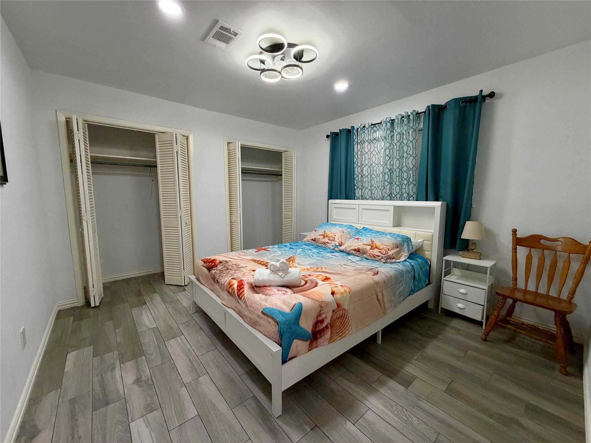 5420 Avenue O, Galveston, TX 77551 Guest bedroom 3, also with double closets and custom ceiling fan light fixture.