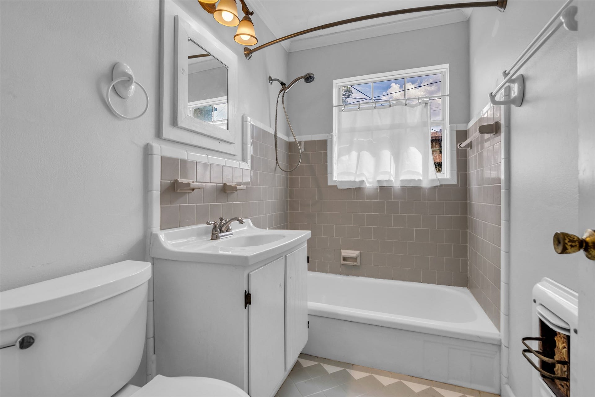 1518 Afton Street, Houston, TX 77055 Original bathroom with vintage medicine cabinet and classic 1950's tile that is in great shape