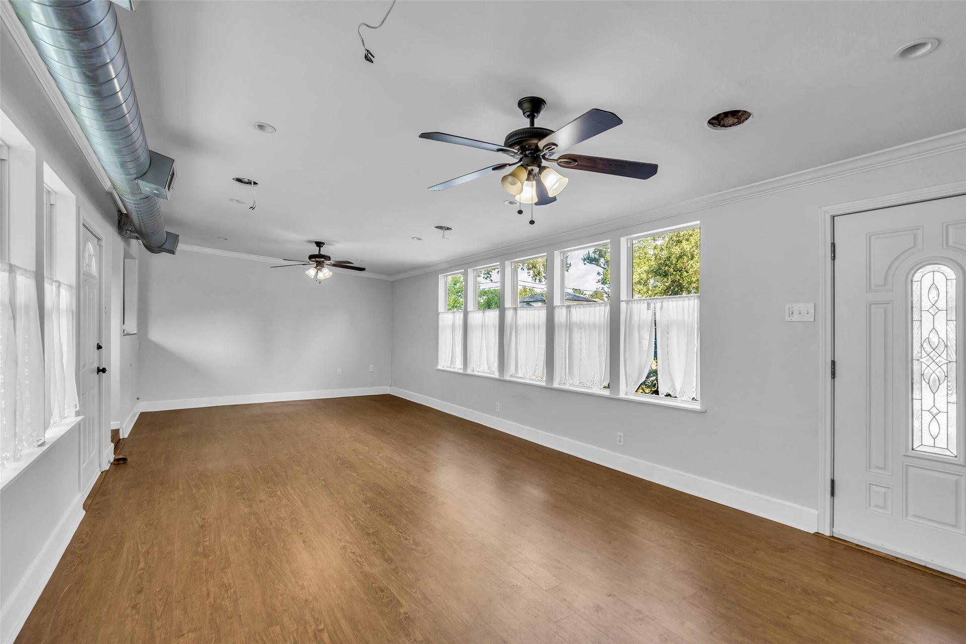 1518 Afton Street, Houston, TX 77055 This space used to be a breezeway and could potentially be opened up to primary bedroom to make a larger living space or kitchen