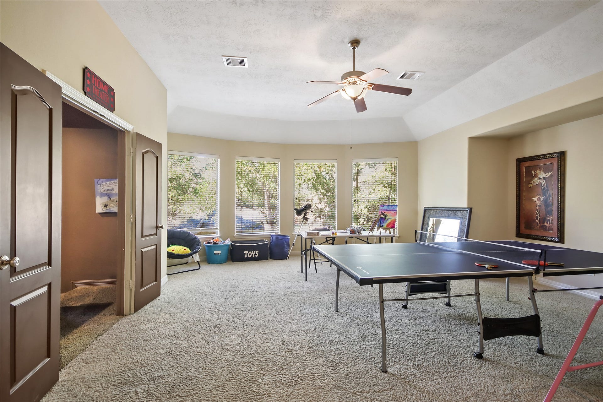 27906 Iberville Glen Dr, Katy, TX 77494 Upstairs game room is ver spacious and overlooks into the backyard. Perfect for some fun and entertainment.